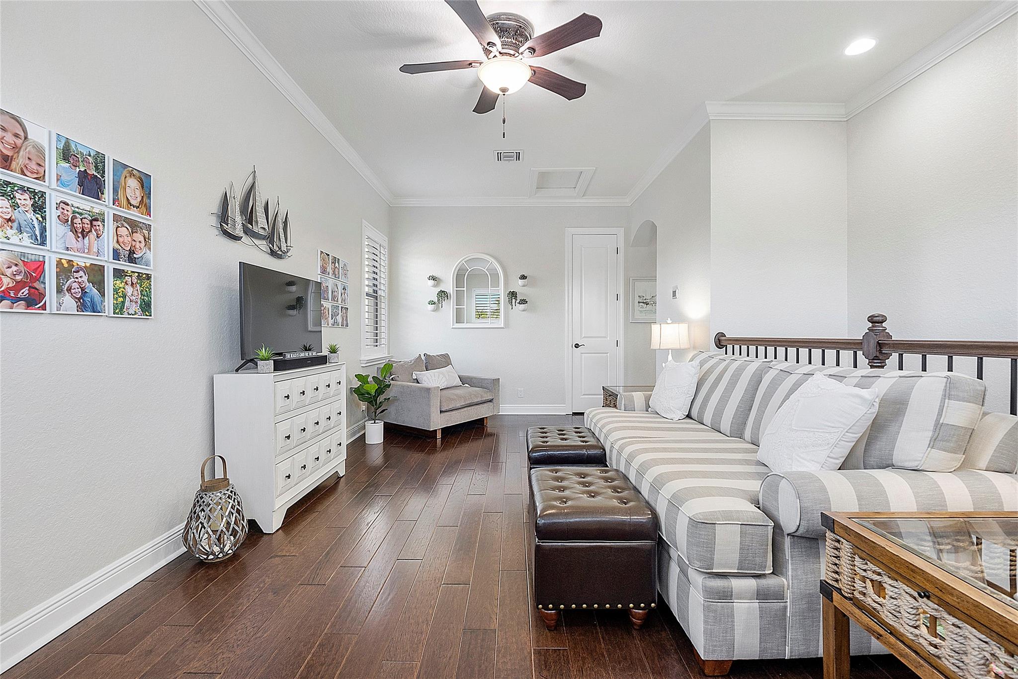 As you enter the upstairs you could really use the entire 2nd floor as an additional apartment if you have family or guests coming over to stay, This is the entryway, A very pretty coastal loft with solid engineered porcelain wood finish flooring, Take a right turn down the hallway to 2 more spacious sized bedrooms and a full bathroom with 2 vanities,