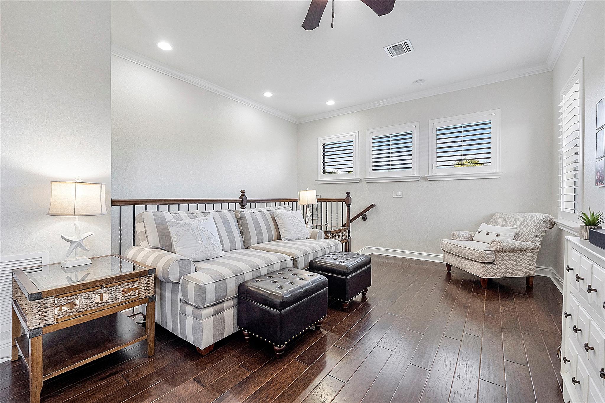 At the top of the wooden banister & wrought iron railing you will enter into the loft area a great place for family gatherings and games. Engineered porcelain built to look like wood and its durable and waterproof.