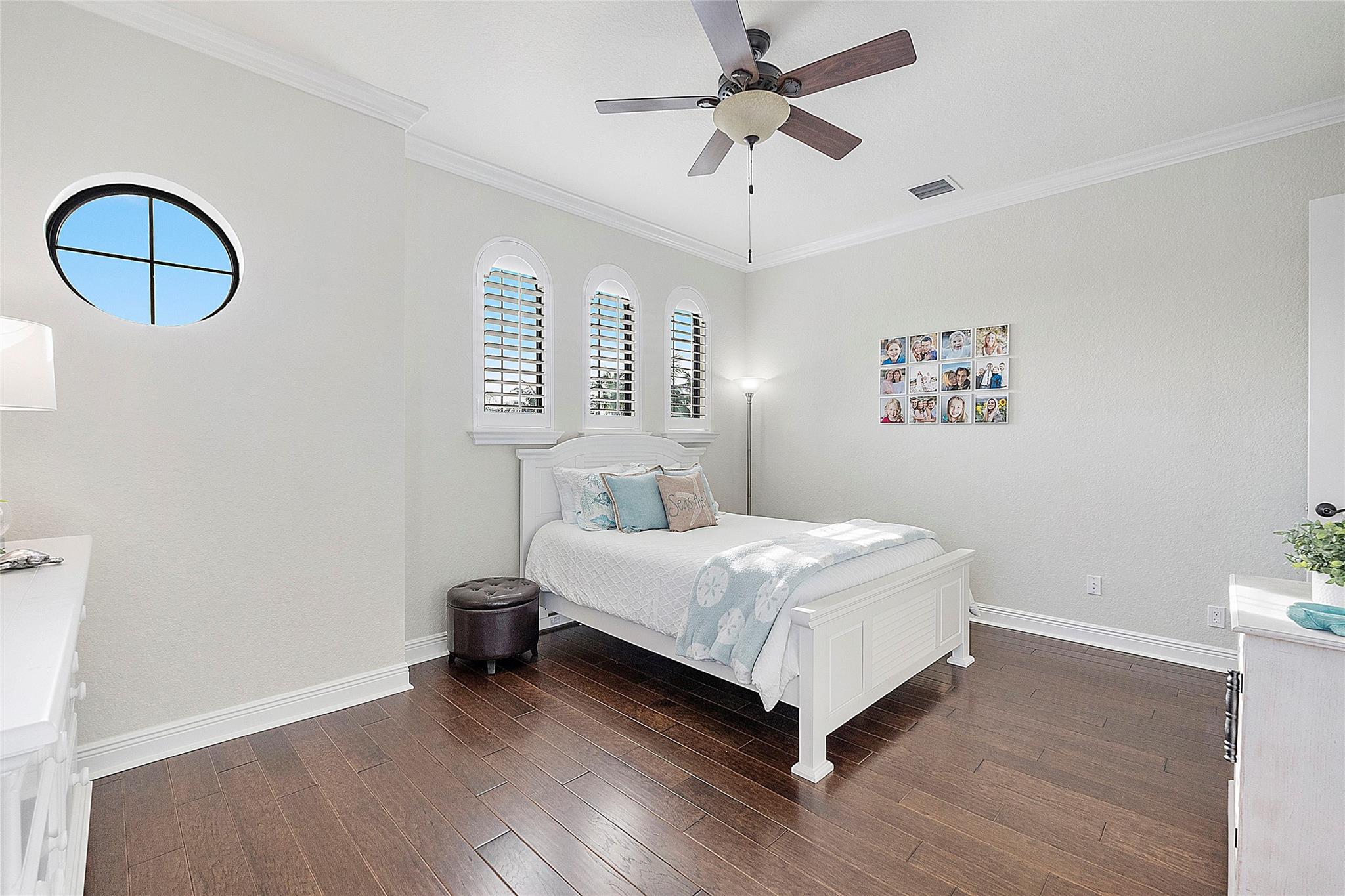 Pretty 3 arched windows plus circle window, Engineered porcelain plank flooring.