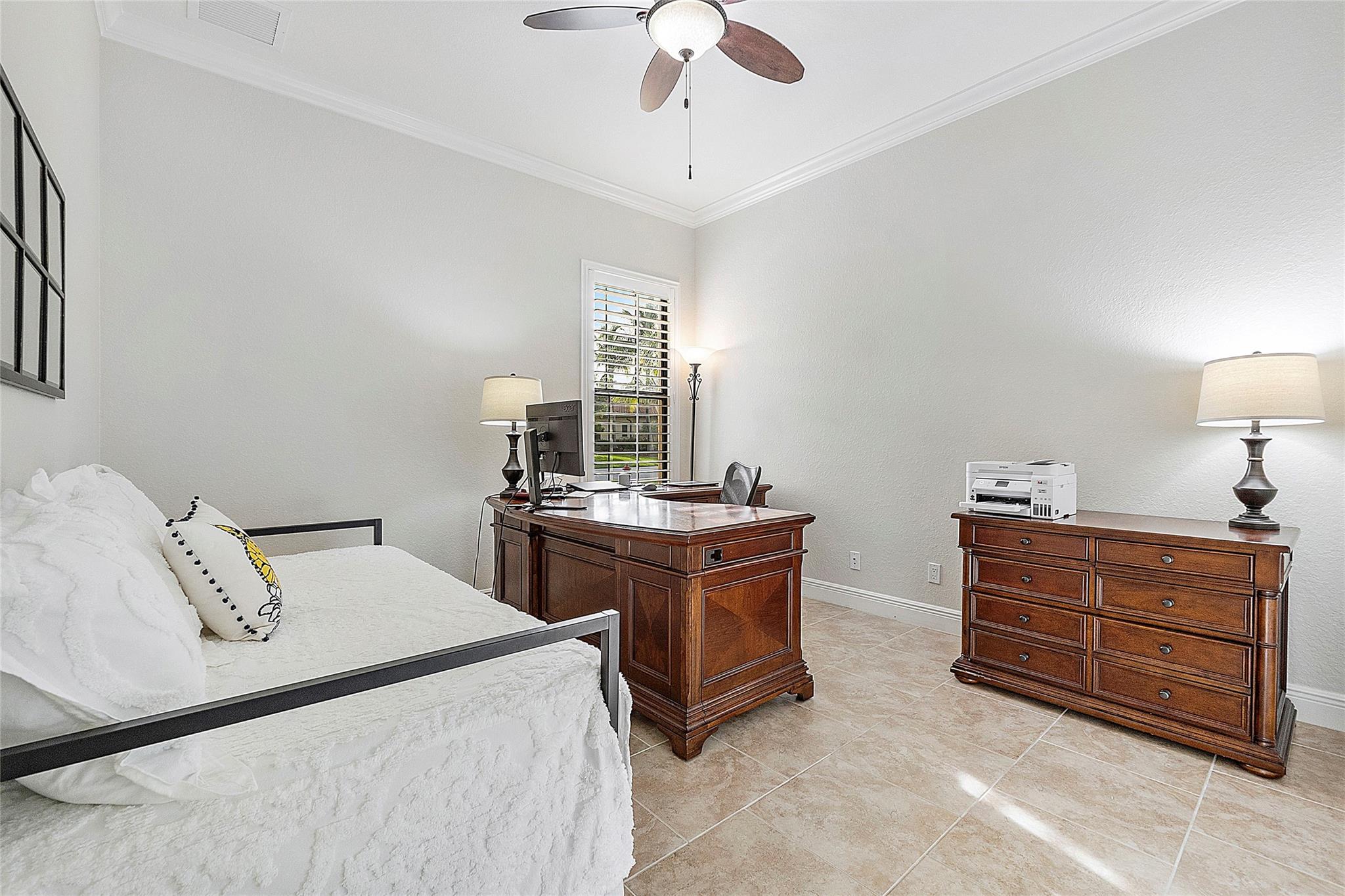 This is the 2nd bedroom situated downstairs as well as the master bedroom which is also downstairs,
This bedroom has a full closet and a beautiful window that overlooks the front of the property and gardens, 
Can be used as a bedroom or a spacious office