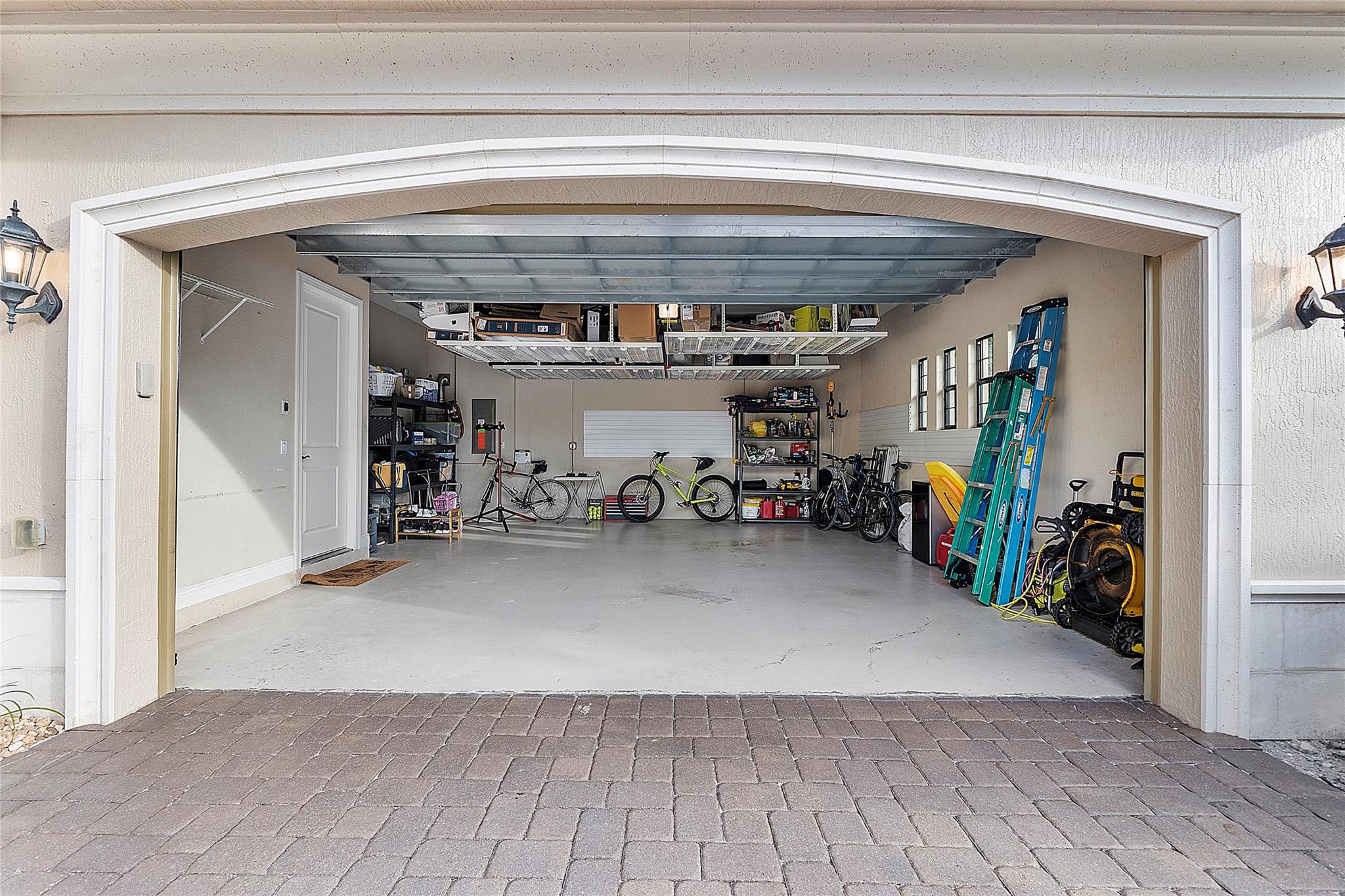2 car garage with extra overhead storage shelving & side shelving