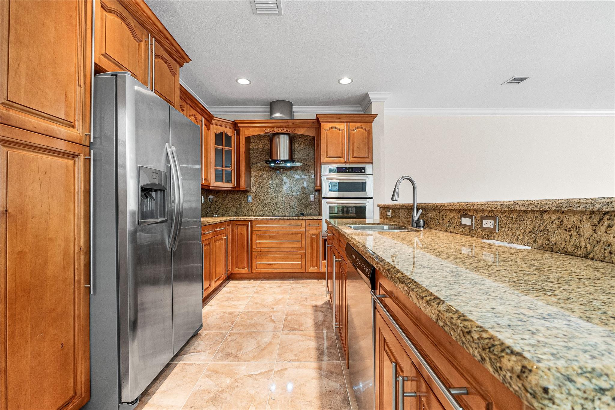 Kitchen with all stainless appliances and plenty of 
 cabinetry.