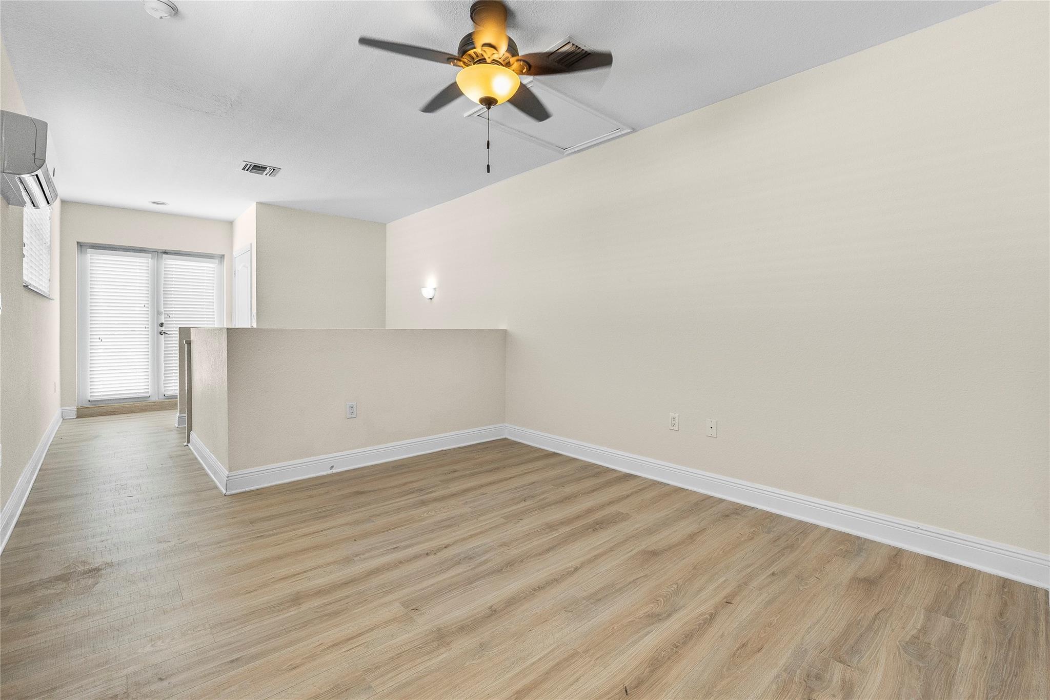 3rd floor loft with access to rofftop deck.