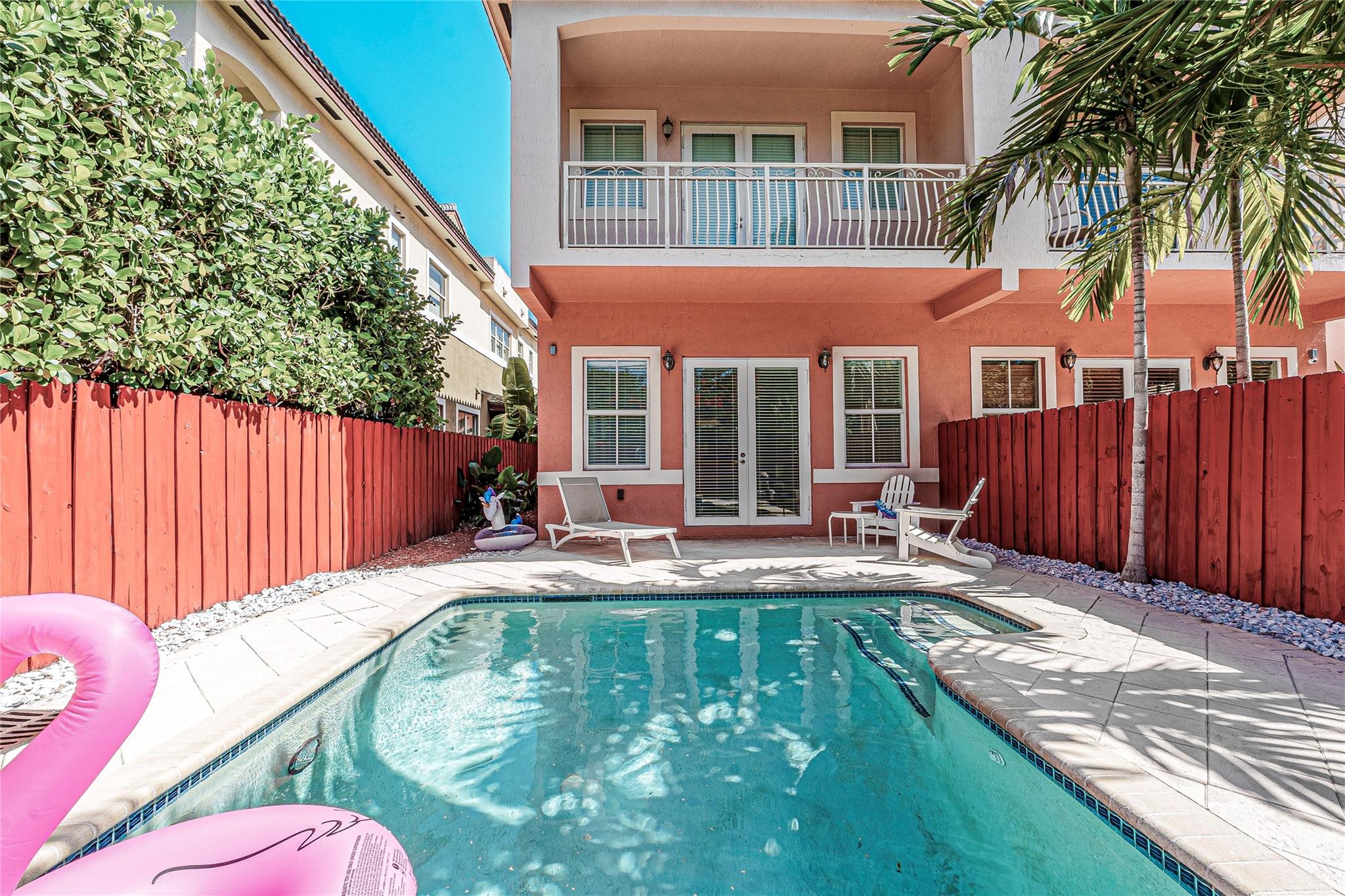 Private pool with view of primary suite balcony.