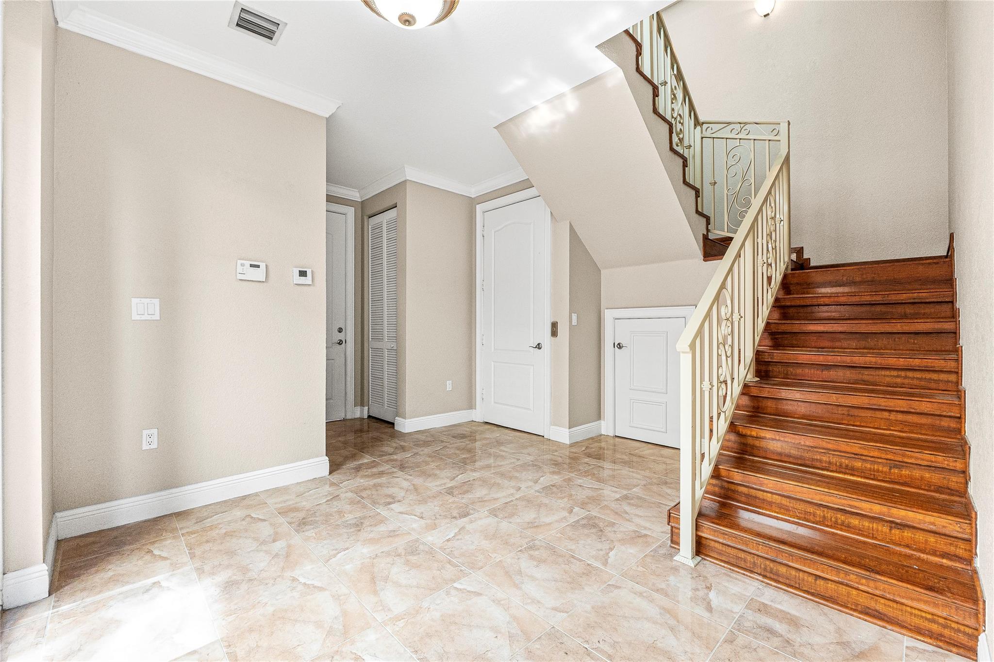 Entryway, with powder room and private elevator entry with access to all floors.