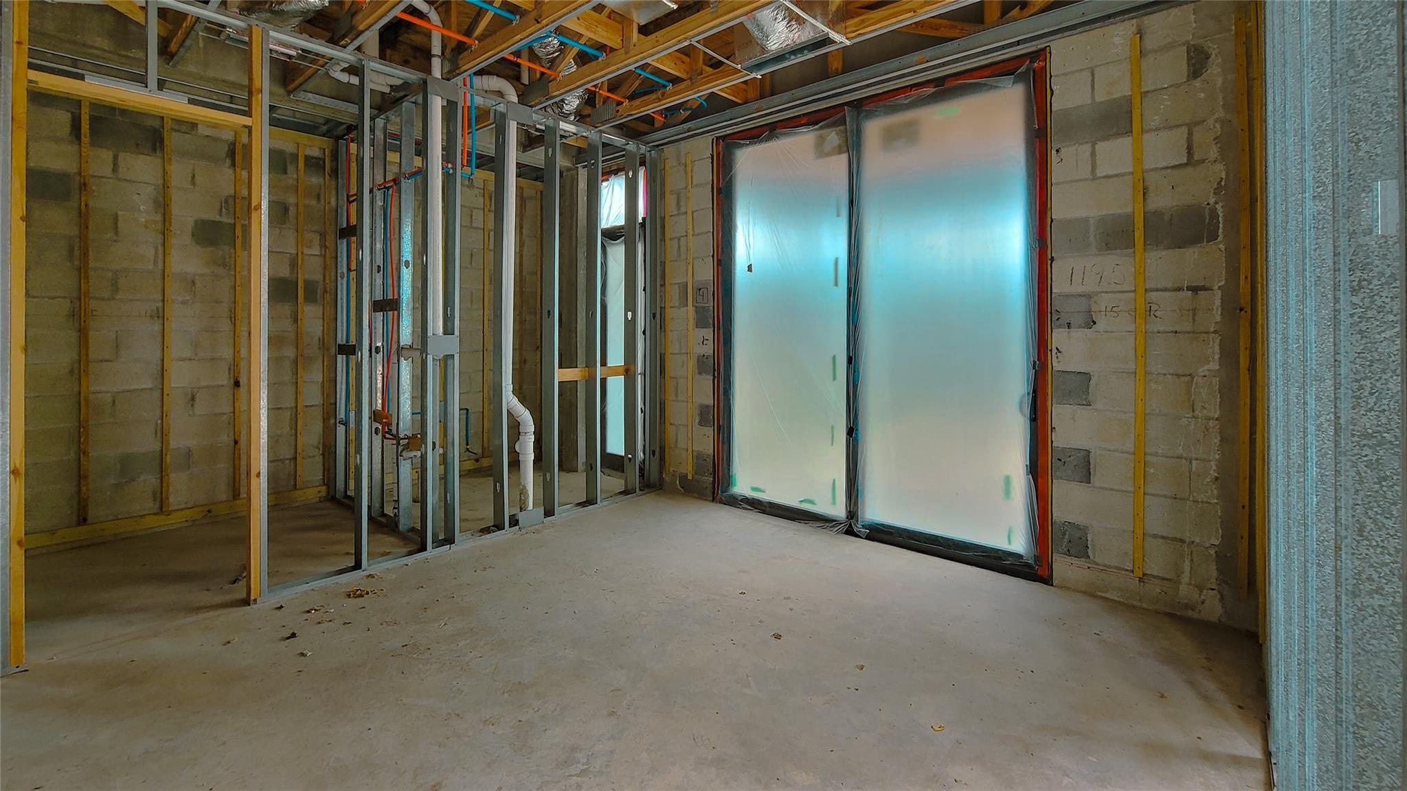 First Floor Bedroom Ensuite with Sliding Glass Door to Covered Lanai and Pool Deck