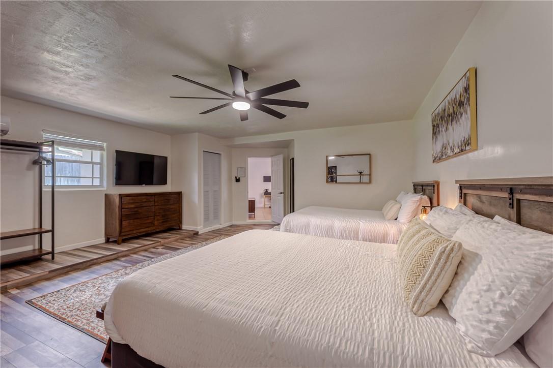 Master bedroom w/ two queen