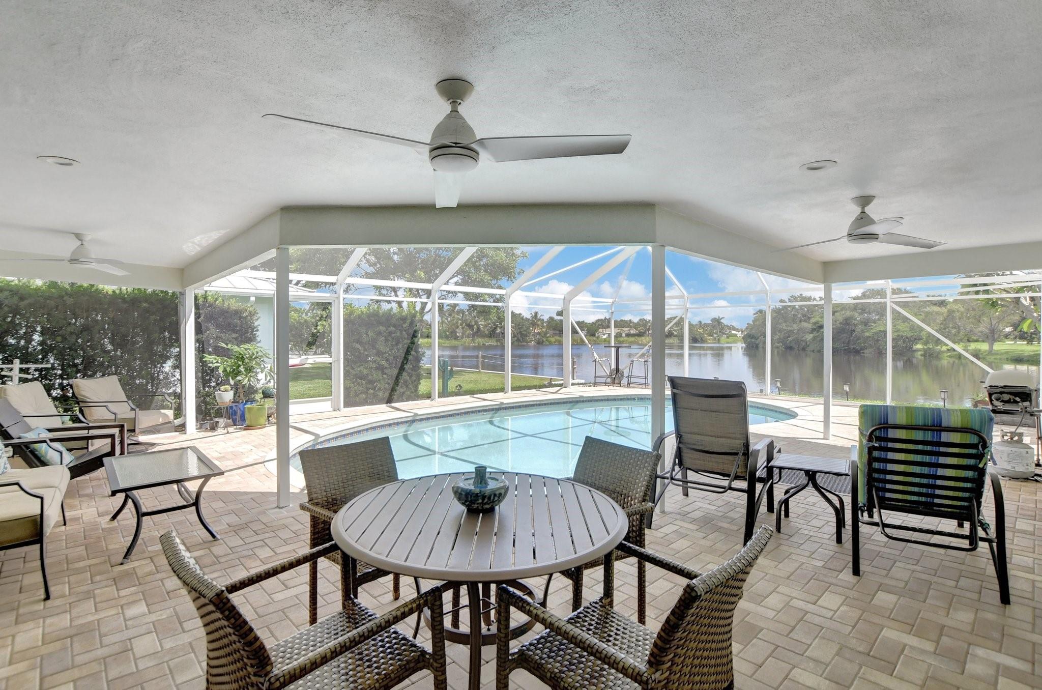 Stay nice and cool under this beautiful lanai with 3 fans!