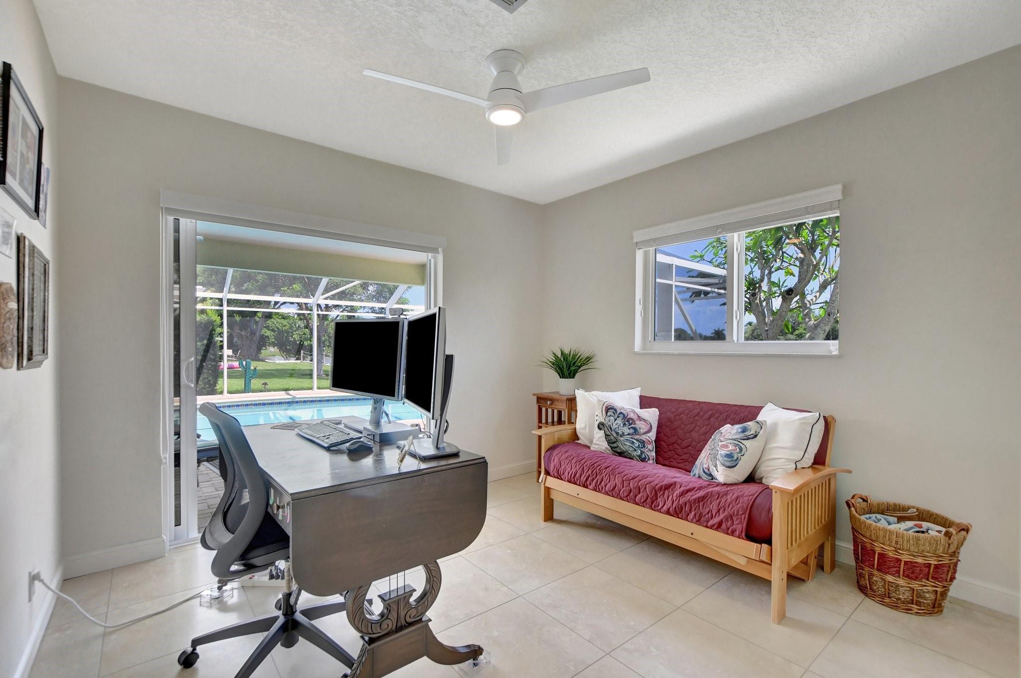 Bedroom with views of the beautiful pool and lake view.
