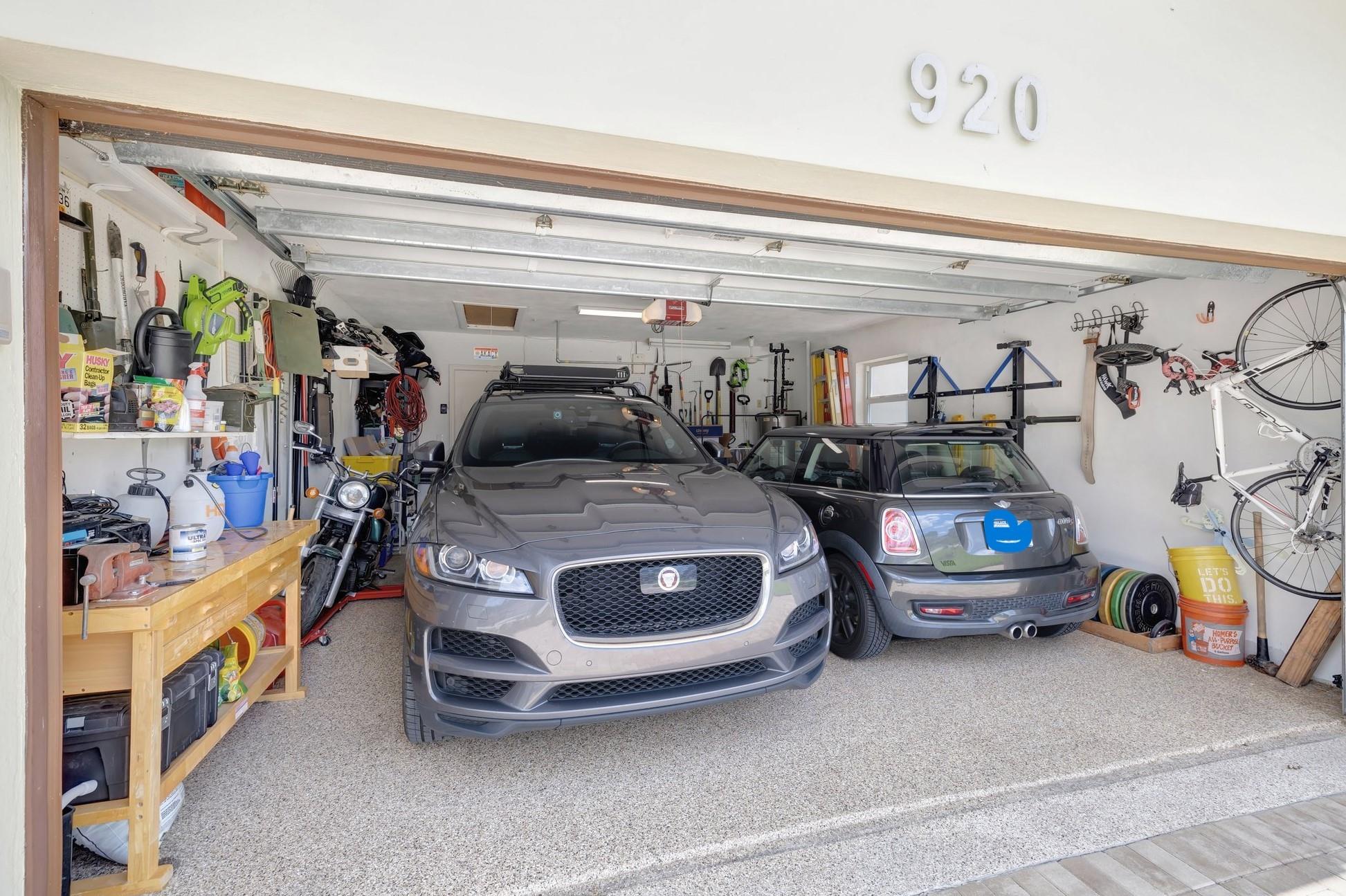 Large two car garage with high quality Epoxy floors done all the way to the pavers. Window in garage.