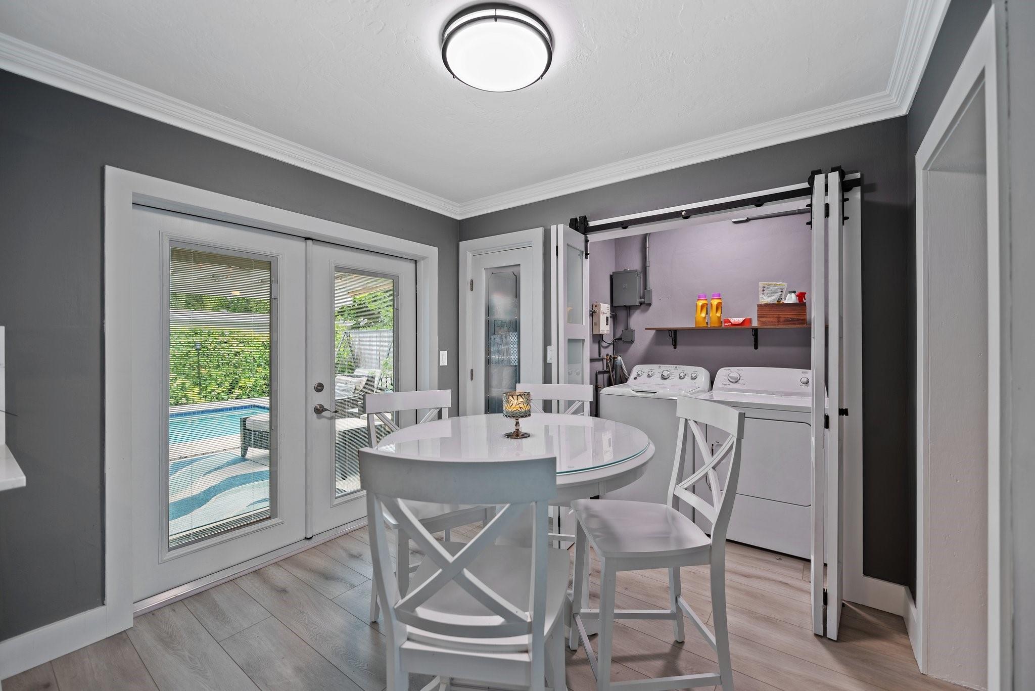 Washer & dryer with doble closet doors for easy access.