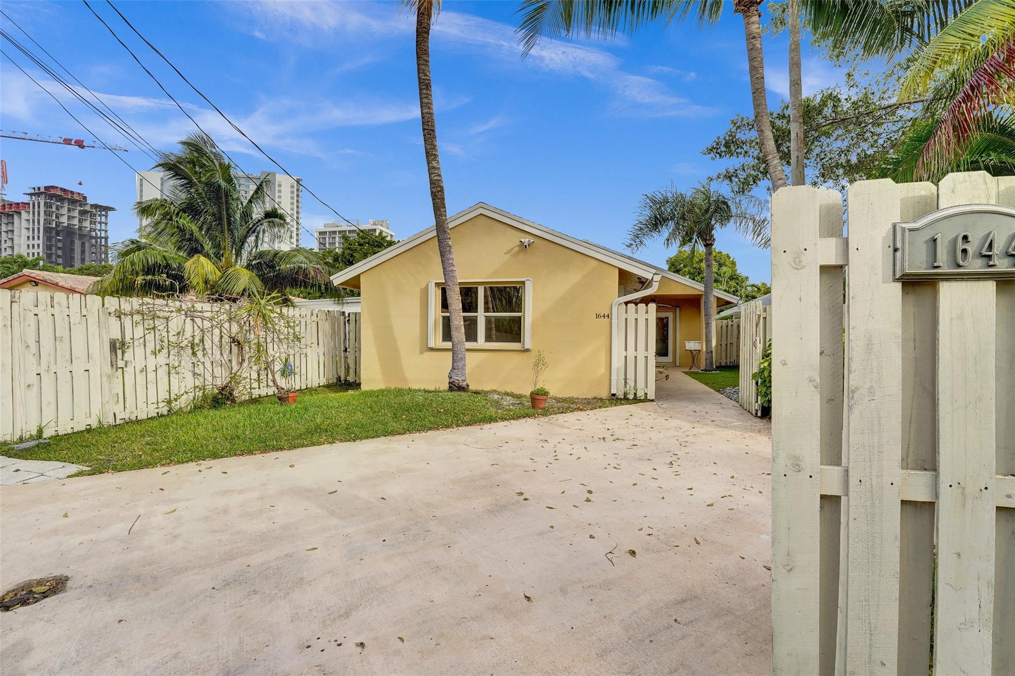 View of Cottage for the Alley with Parking