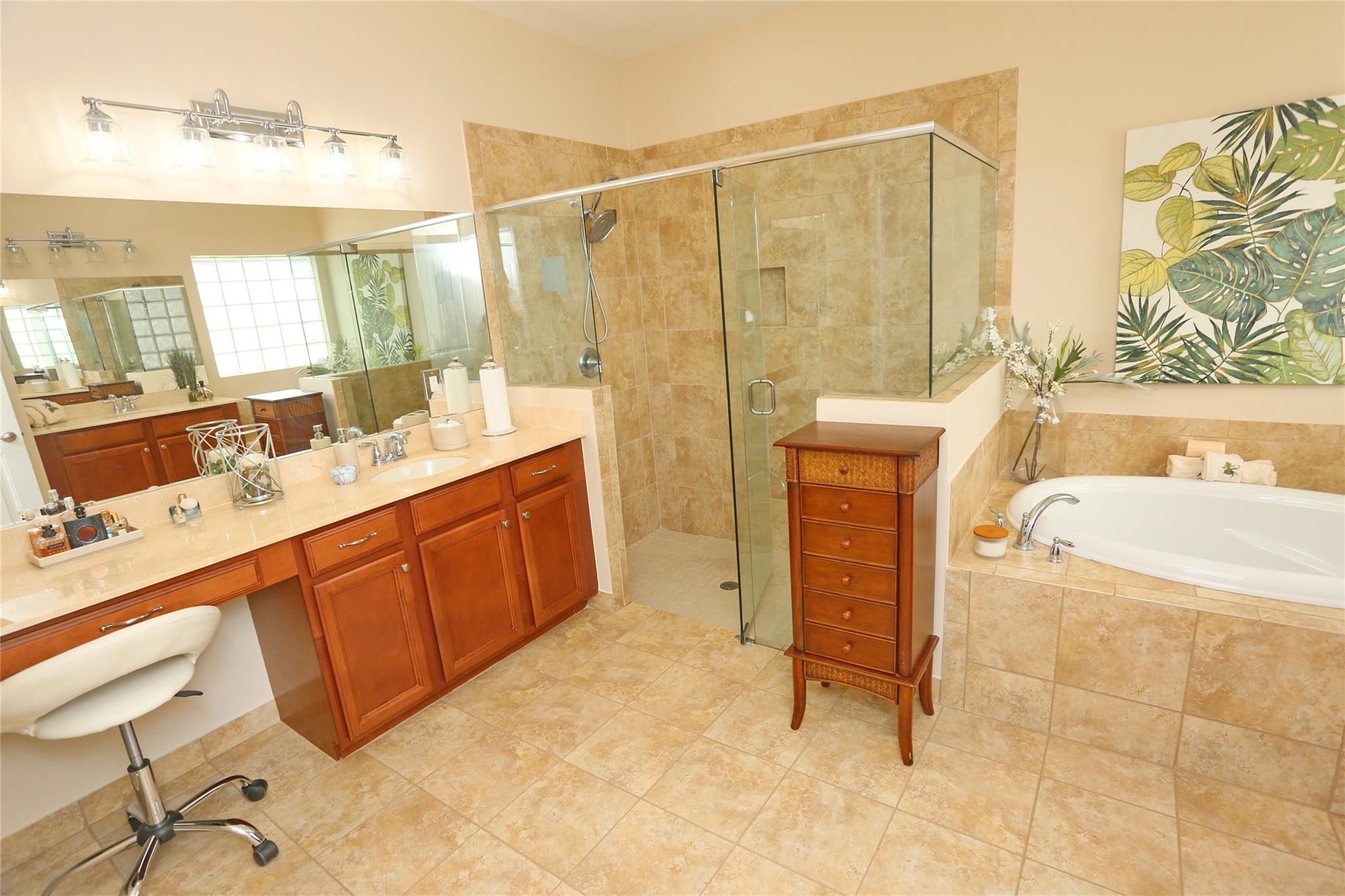 Large shower, garden tub and dual vanities