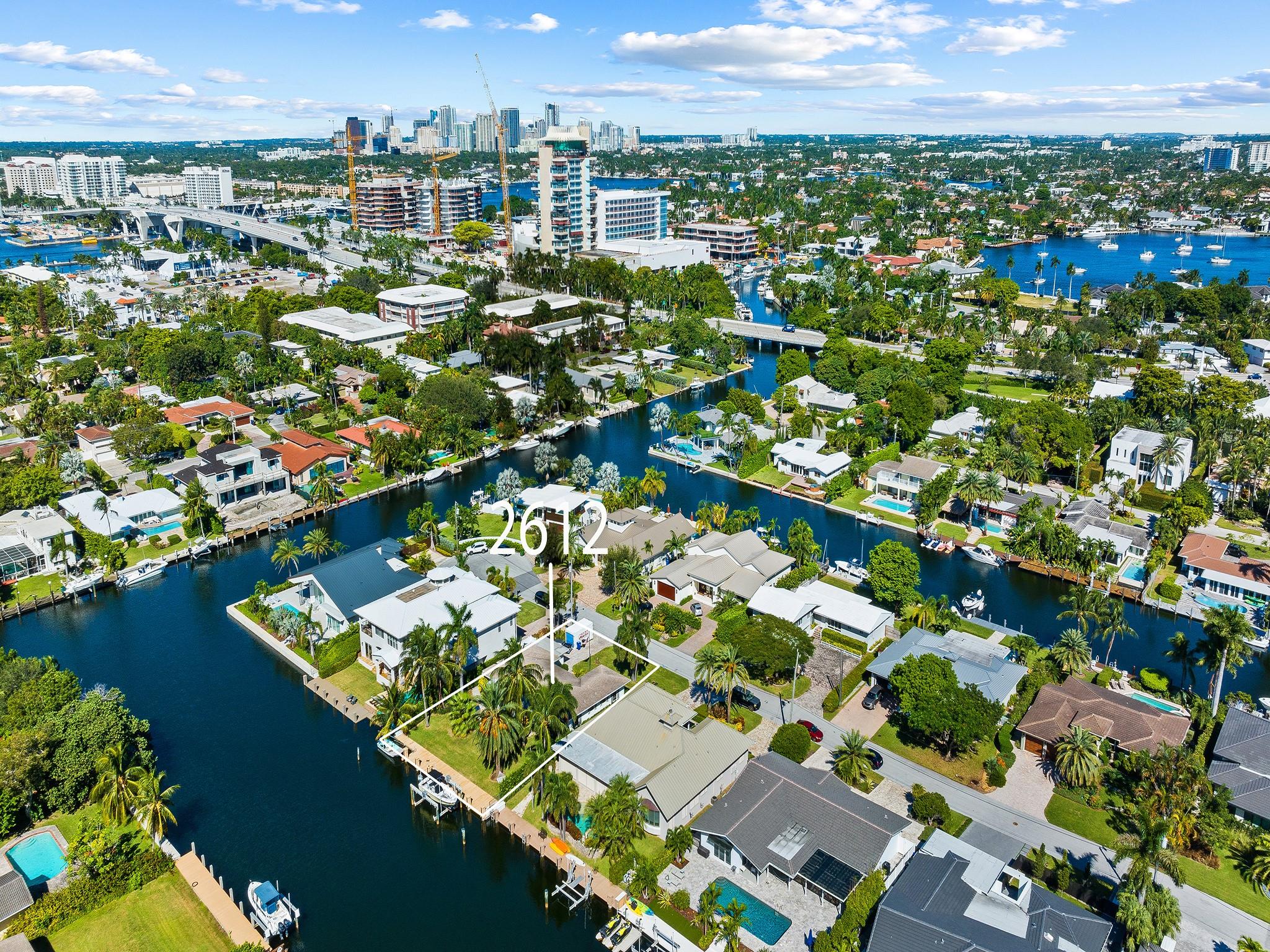 Aerial View Of Home With Box & City Skyline