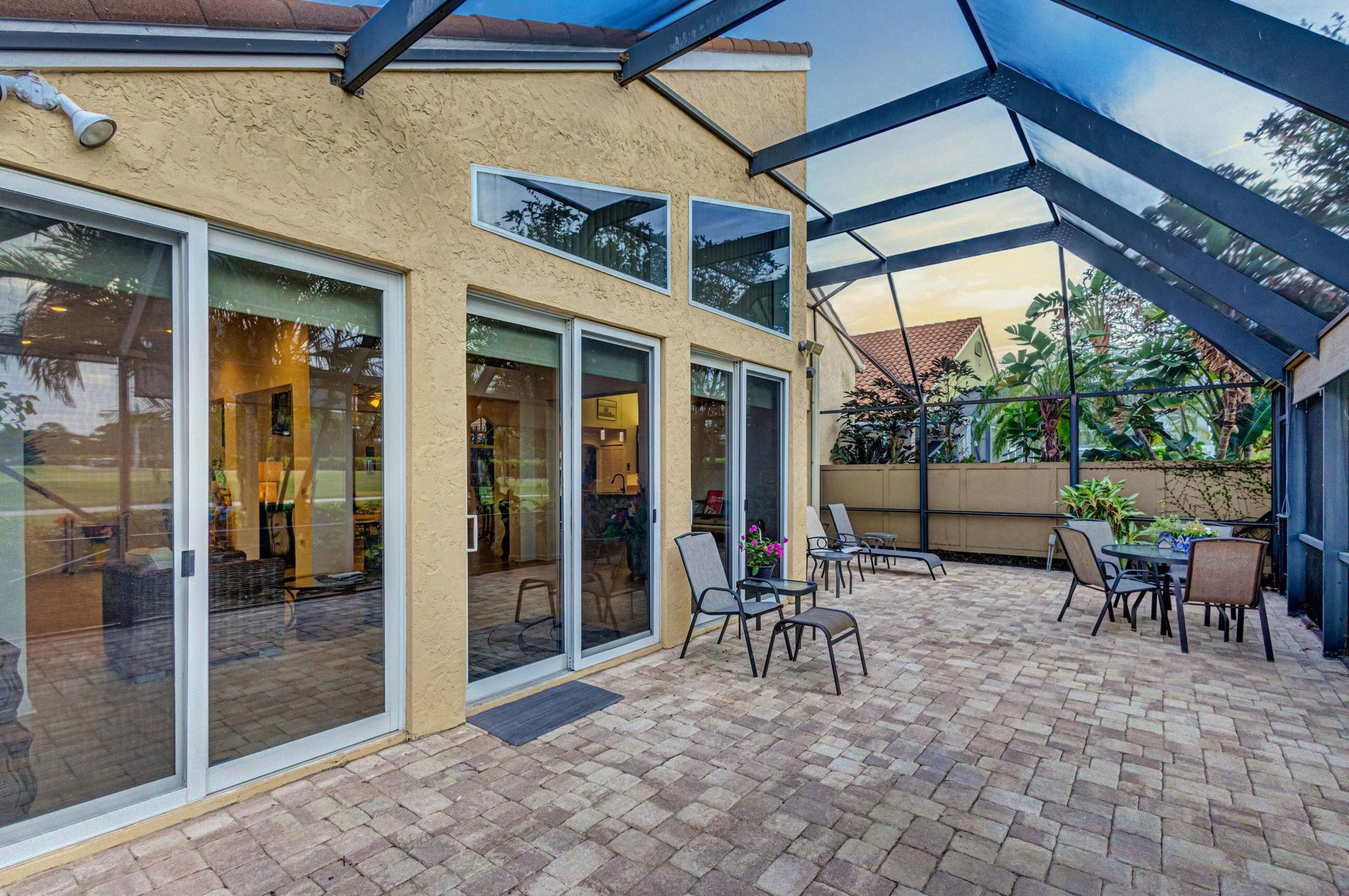 ALL ENCLOSED PAVED PATIO ... NOTICE THE HURRICANE IMPACT SLIDING DOORS!!