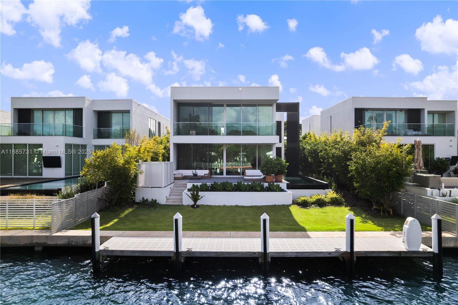 Indulge in the pinnacle of modern living in one of only 8 exclusive single-family villas at The Ritz-Carlton Residences. Designed by renowned architect Piero Lissoni, this 2-story, 5,000-SF estate offers 4 BR,4.5 BA & 55’ of WF, private dock w/ Biscayne Bay & Atlantic Ocean access & a heated lap pool, creating a sanctuary of tranquility & elegance. Sophisticated interiors feature Venetian plaster walls, white oak floors & custom stone finishes. Boffi kitchen equipped w/ Gaggenau appliances, blends beauty & functionality for effortless entertaining. Luxuriate in the serene primary suite w/ dual walk-in closets, private balcony & a spa-inspired Boffi bathroom. Rare opportunity to enjoy the privacy of a villa w/ the world-class amenities, services, & luxurious lifestyle of The Ritz-Carlton