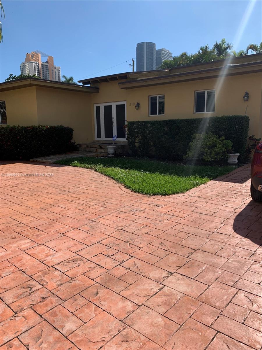 A TOTALLY REMODELED SINGLE HOUSE IN A GREAT NEIGHBORHOOD, SUNNY ISLES . AMAZING LOCATION !!!4 bedrooms, 3 full bathrooms, a large Den with French doors to the backyard . A Jacuzzi  and a 200 SF Shed . A patio for entertainment. 2 Refrigerators inside the house and a third one in the shed . 2 bedrooms and a bathroom have a separate entrance . Use for family or rent out . Upgraded  Electrical panel , impact windows , skylights and doors . Porcelain and marble bathrooms . Driveway can accommodate up to 10 cars . Near A+ Schools . Walking distance to the beach , supermarkets and the house of gods .