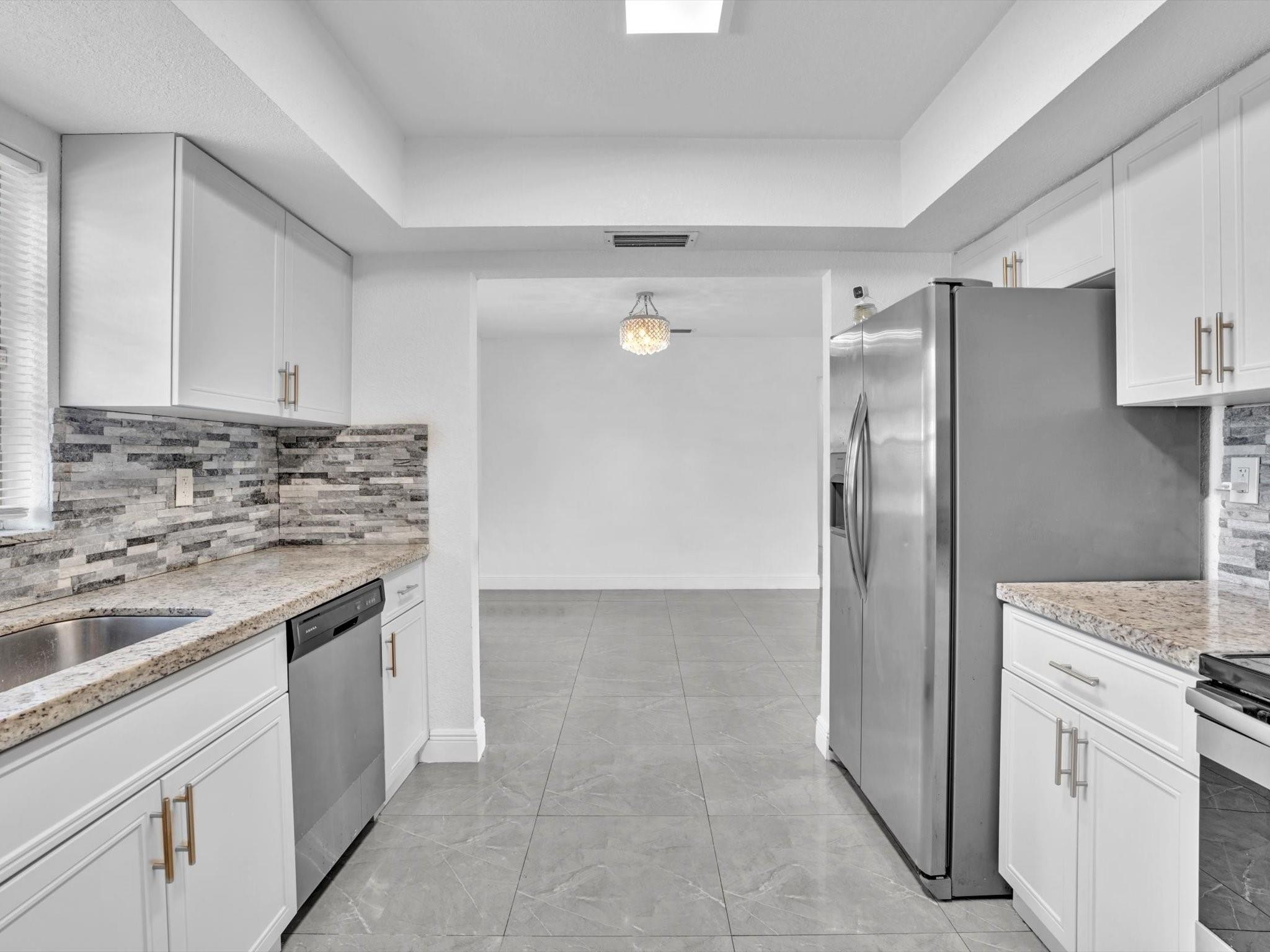 Kitchen opening to Dining Area