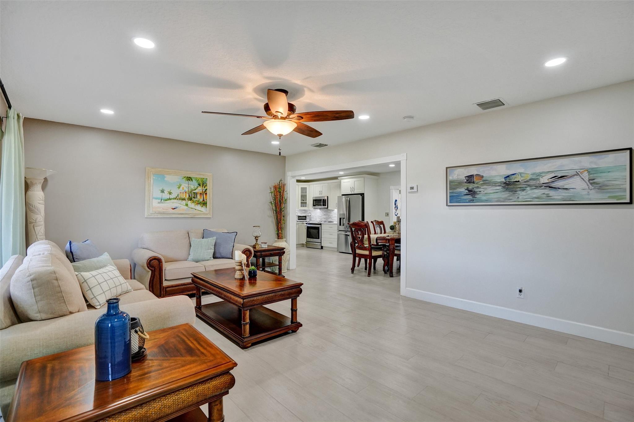 TILE wood plank floors Thur out house.