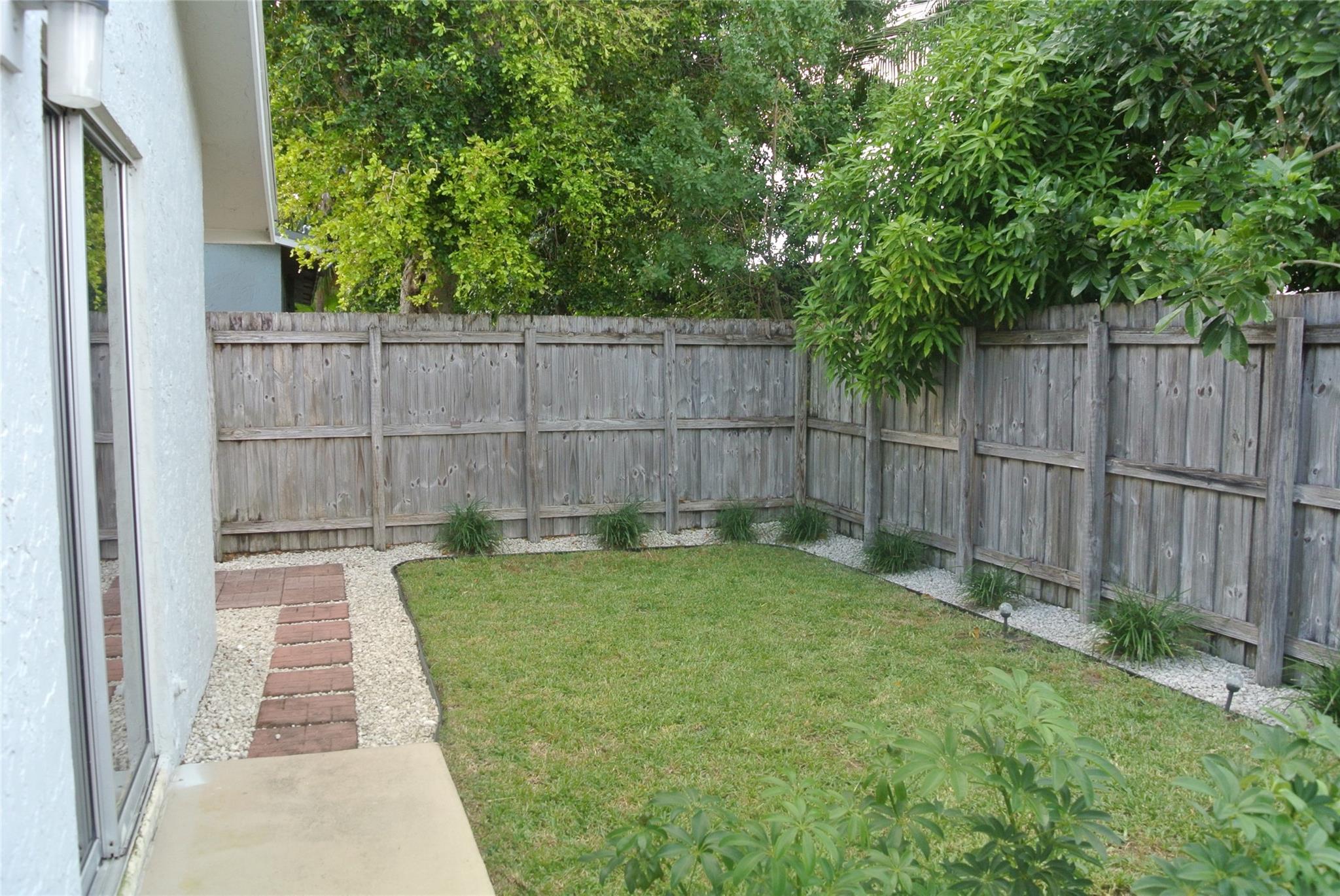 Very private back yard w/ nice landscape and rocks