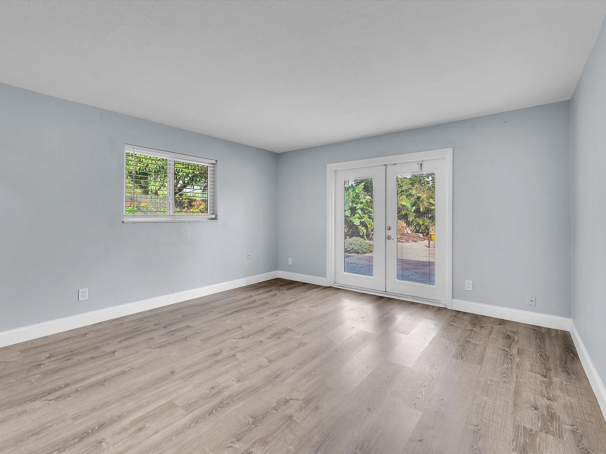 Primary Bedroom with Door to Pool Area
