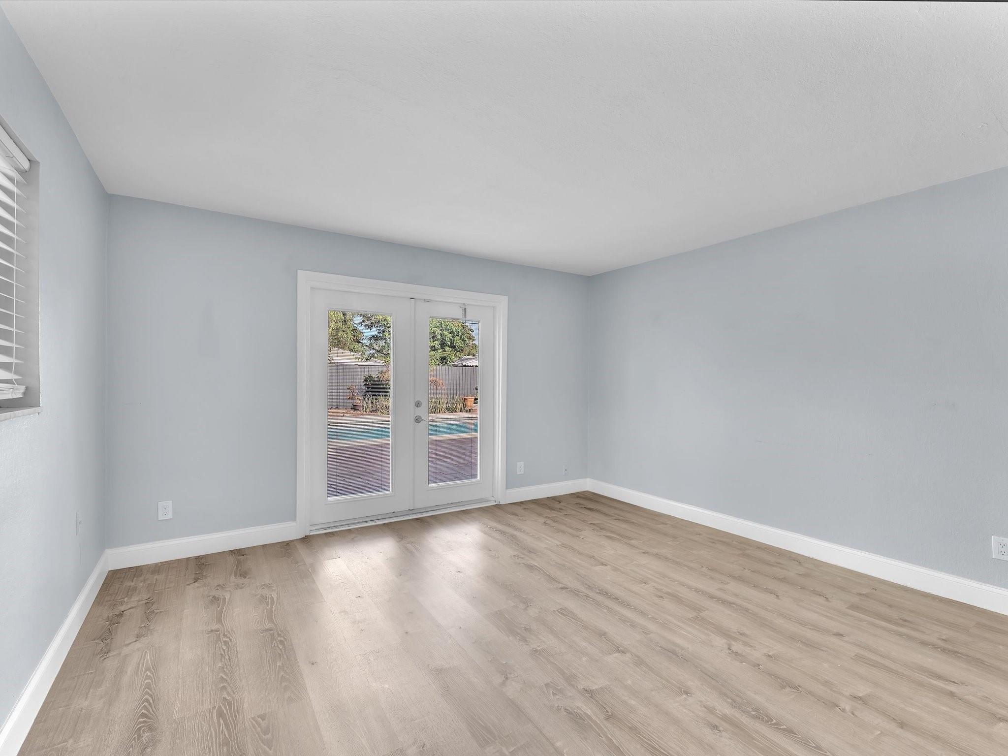 Primary Bedroom with Door to Pool Area