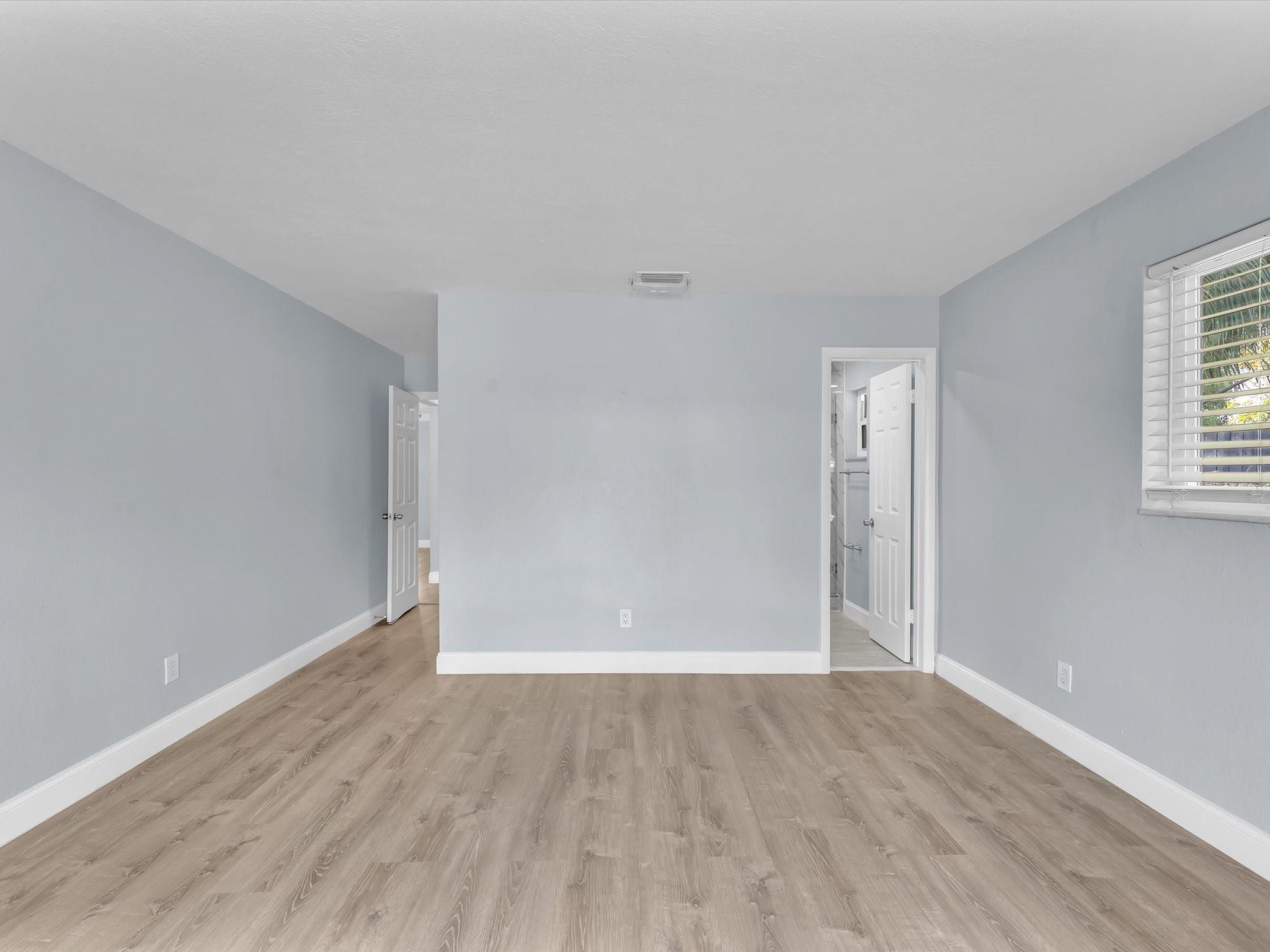 Primary Bedroom with Door to Pool Area