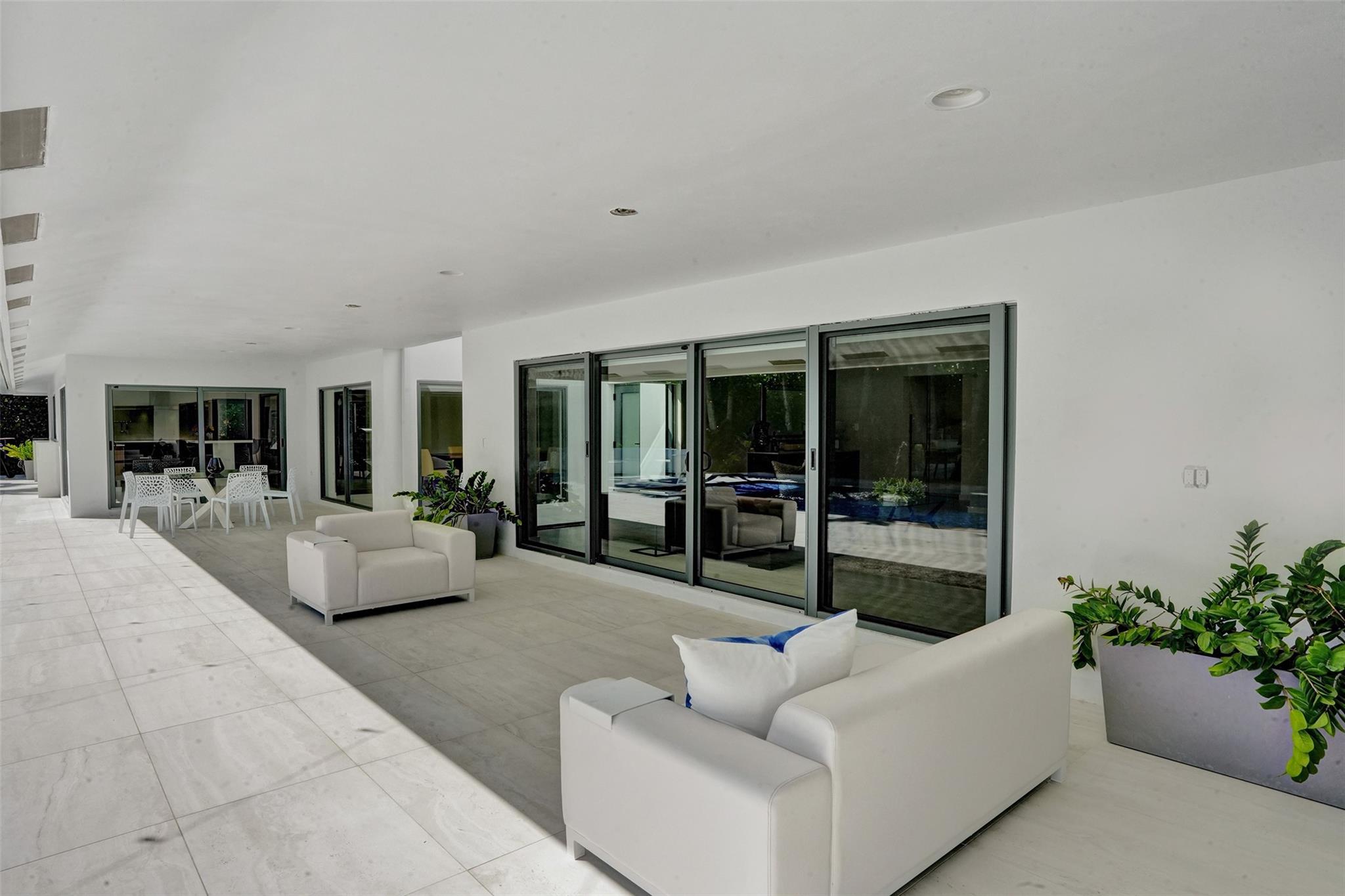 Oversized Covered Patio Terrace Overlooks Salt Water Heated Pool + Spa Lounge + Features Enough Space For Multiple Seating + Dining Areas...