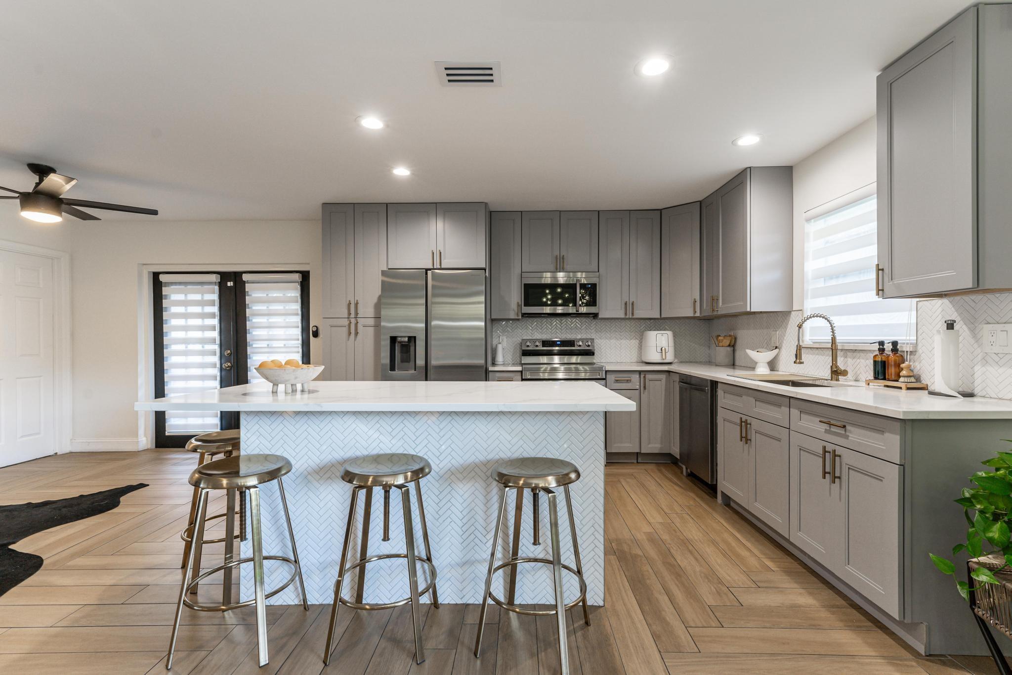Modern Kitchen with a Chevron Tile Accent on the Island