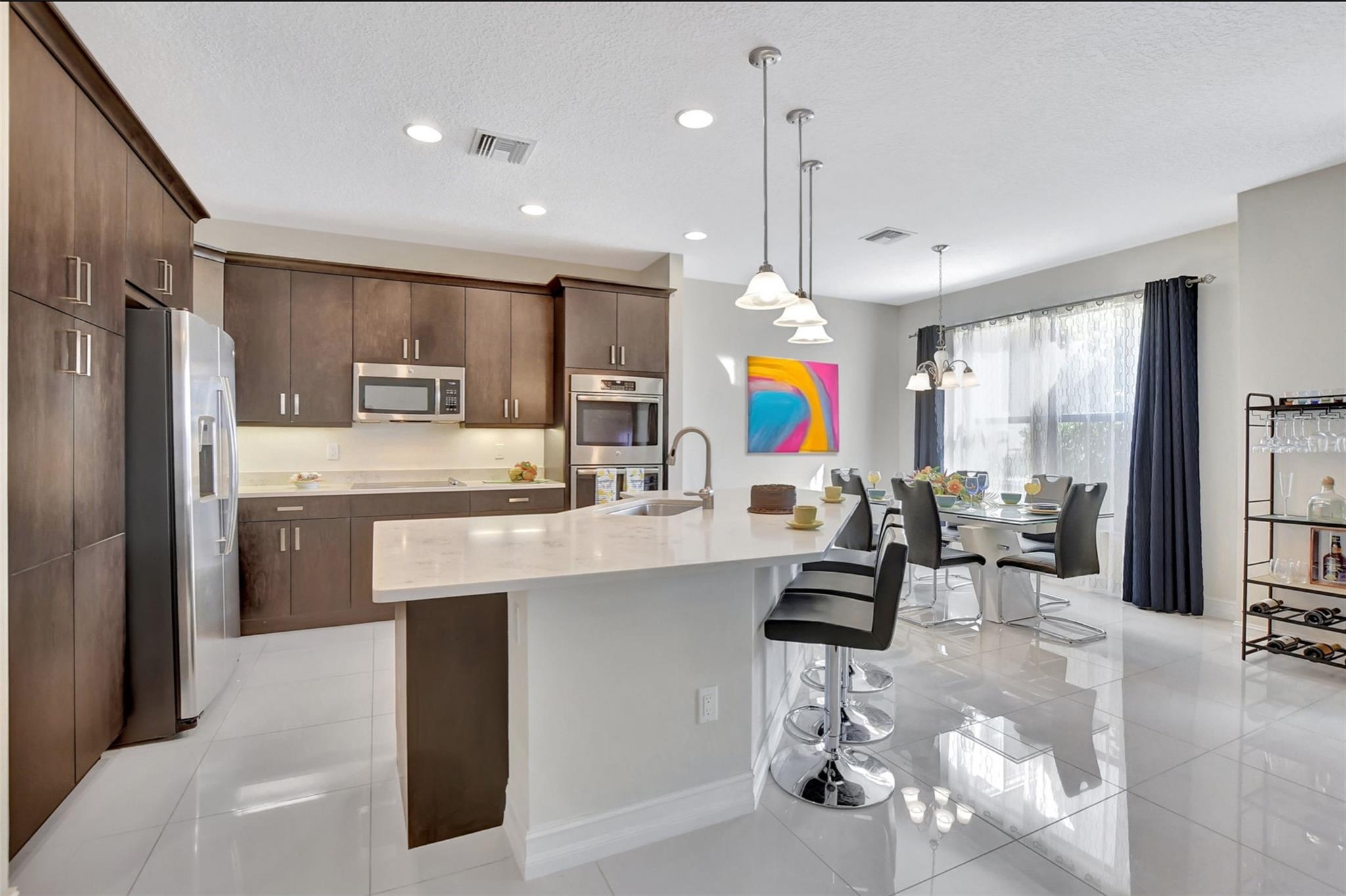 Welcome home to this SENSATIONAL 3/2.5 with sweeping lake and golf views!!