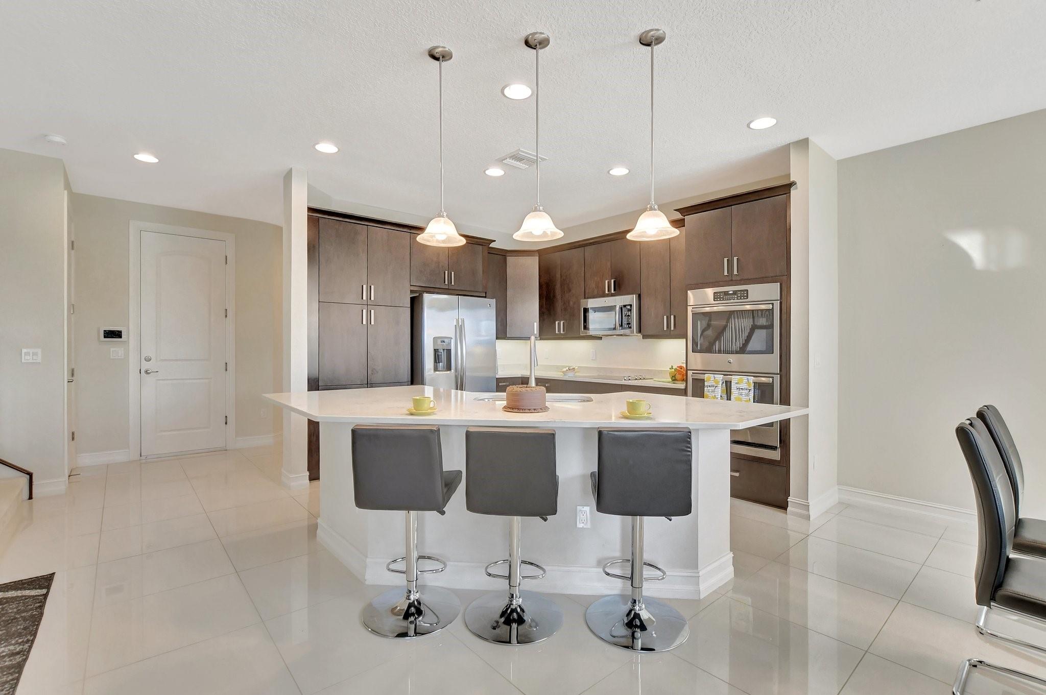 Enjoy meals with family and friends in your kitchen with oversized island.