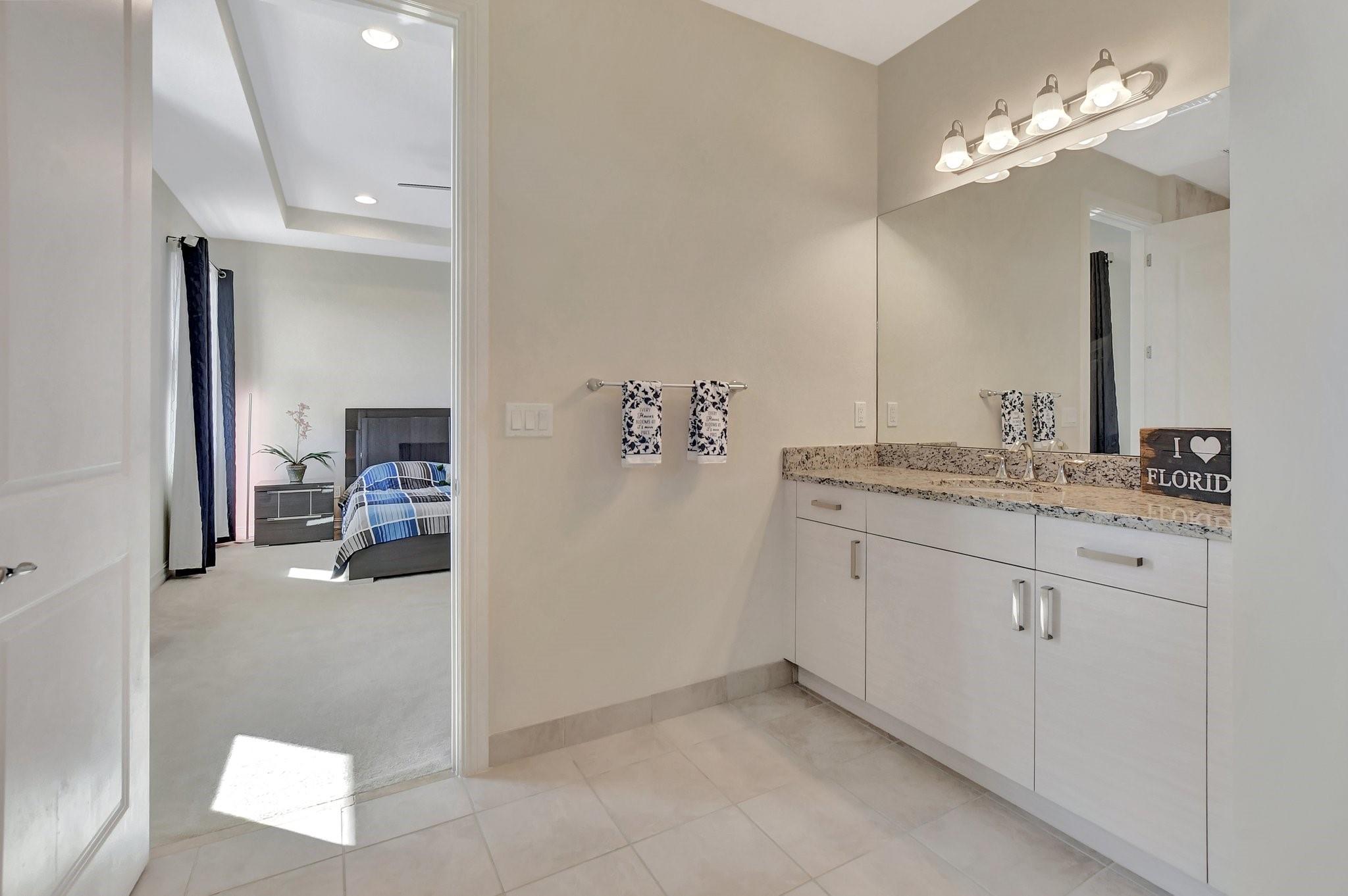 Split vanities with granite counters and undermount sinks.