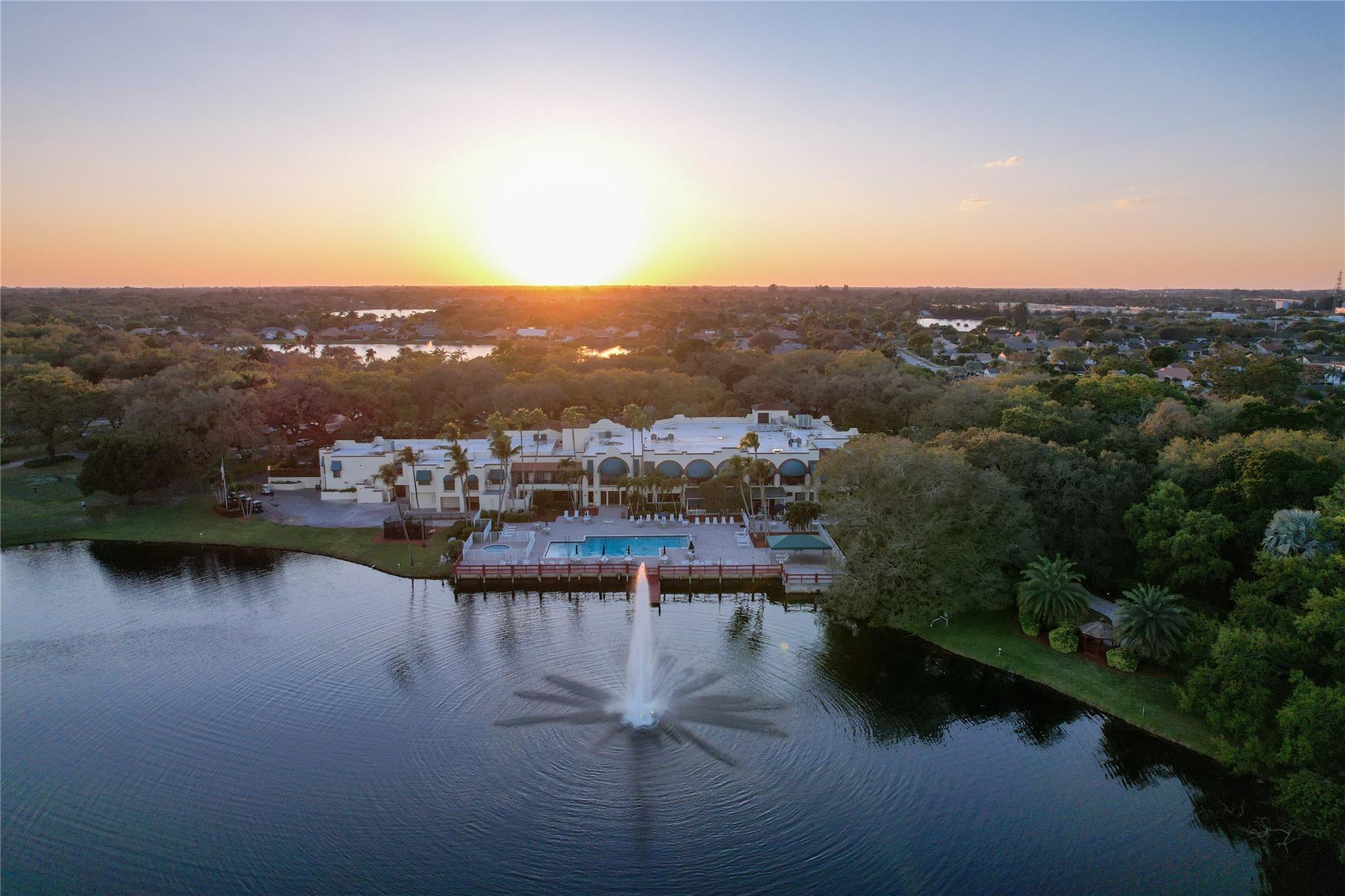 Drone shot clubhouse and lake fountain