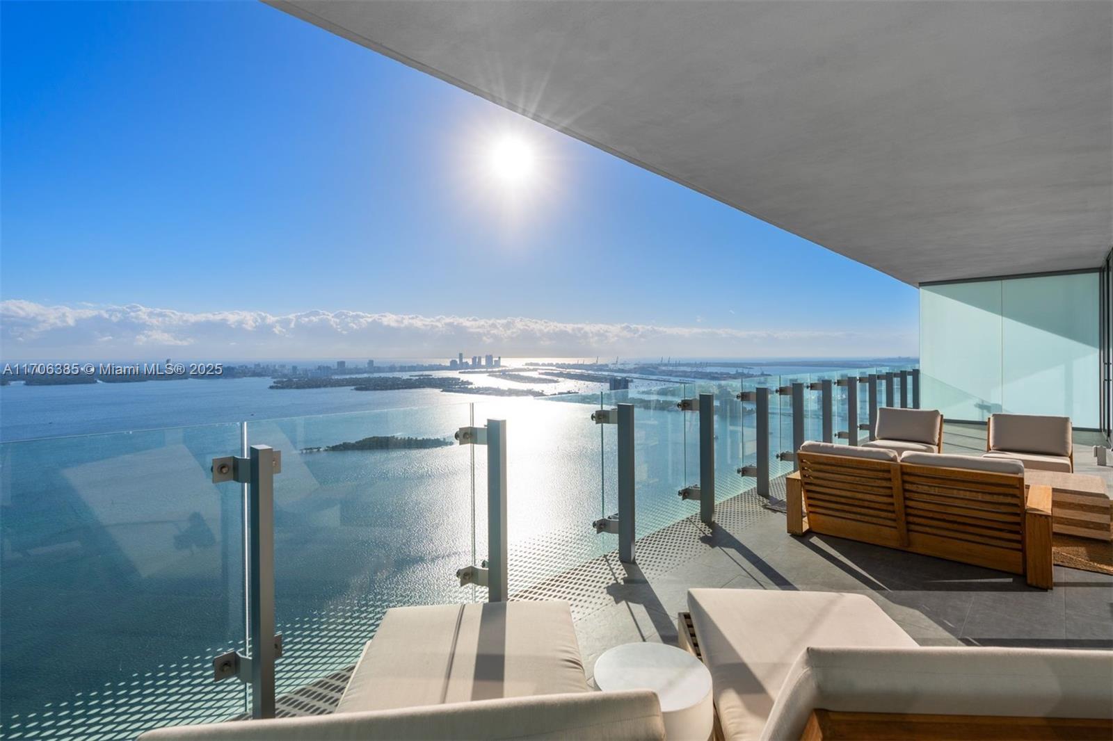 This exquisite 2-bed + Den, 3.5-bath residence offers nearly 2,500 sq. ft., with the den having a closet and full bath, easily convertible to a 3rd bedroom (see rendering—design by VD8 Studio). Enjoy stunning east-facing Biscayne Bay views from floor-to-ceiling windows and a spacious 500 sq. ft. balcony. Features include custom Italian cabinetry, premium appliances, motorized blinds, spa-like primary bath, and custom closet. Includes 2 garage spaces. World-class amenities: infinity pool, fitness center, spa, tennis, playroom, and theater.