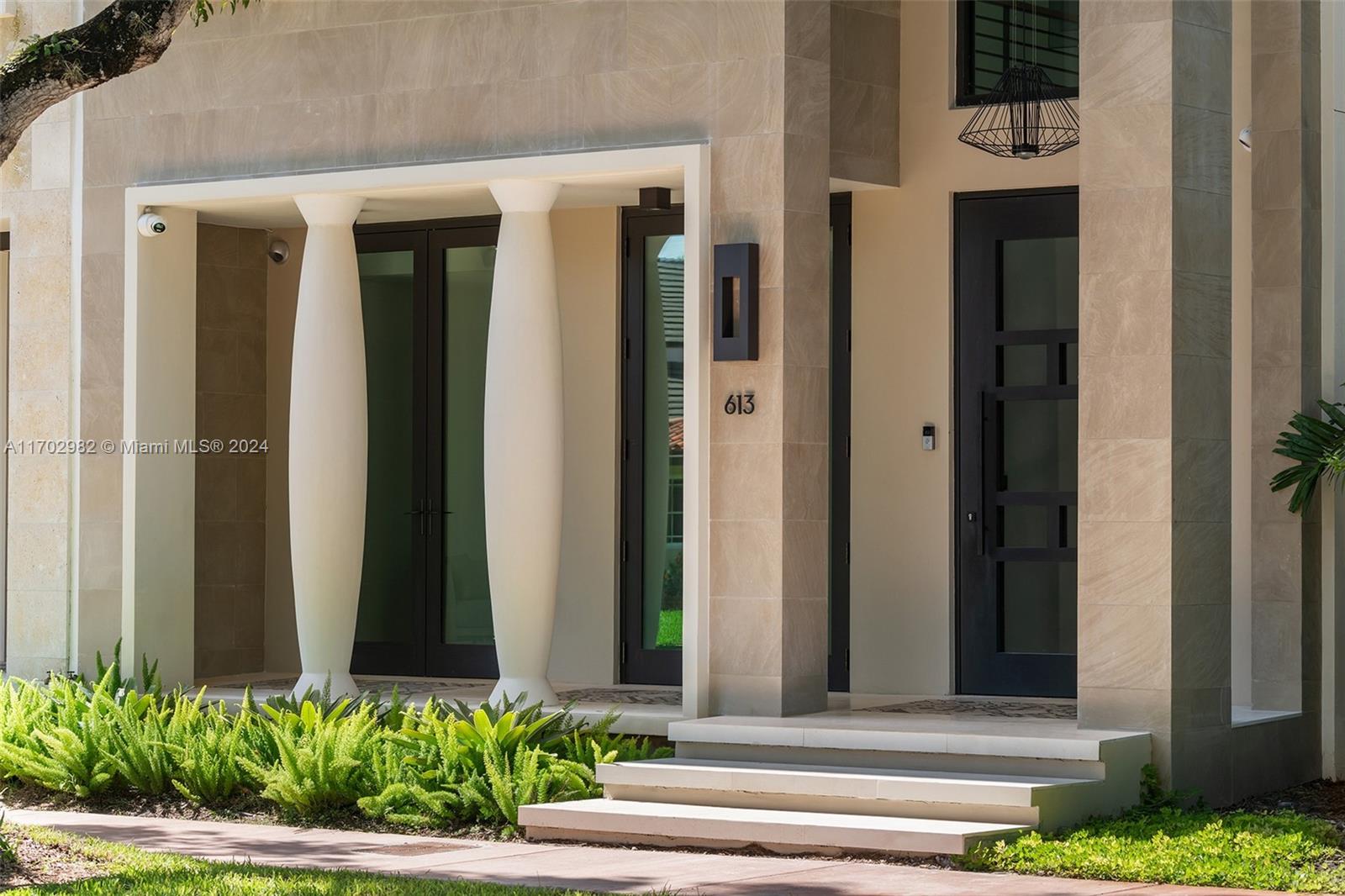 Welcome to your dream home, situated in beautiful Coral Gables.This brownstone-style residence, built in 2021, stands proudly with four stories, featuring a total of five spacious bedrooms, a four-car garage, exquisite custom millwork and interior design, and an impressive rooftop area complete with a pool and breathtaking views.The home showcases an inviting open-air courtyard, equipped with top-of-the-line appliances and a large island perfect for casual dining or entertaining guests. The bedrooms offer ample space for family members or visitors and the home office and gym can easily be converted into additional guest rooms or hobby areas to suit your lifestyle.Equipped with smart home technology, various security systems, and a meticulously designed home theater for sports enthusiasts