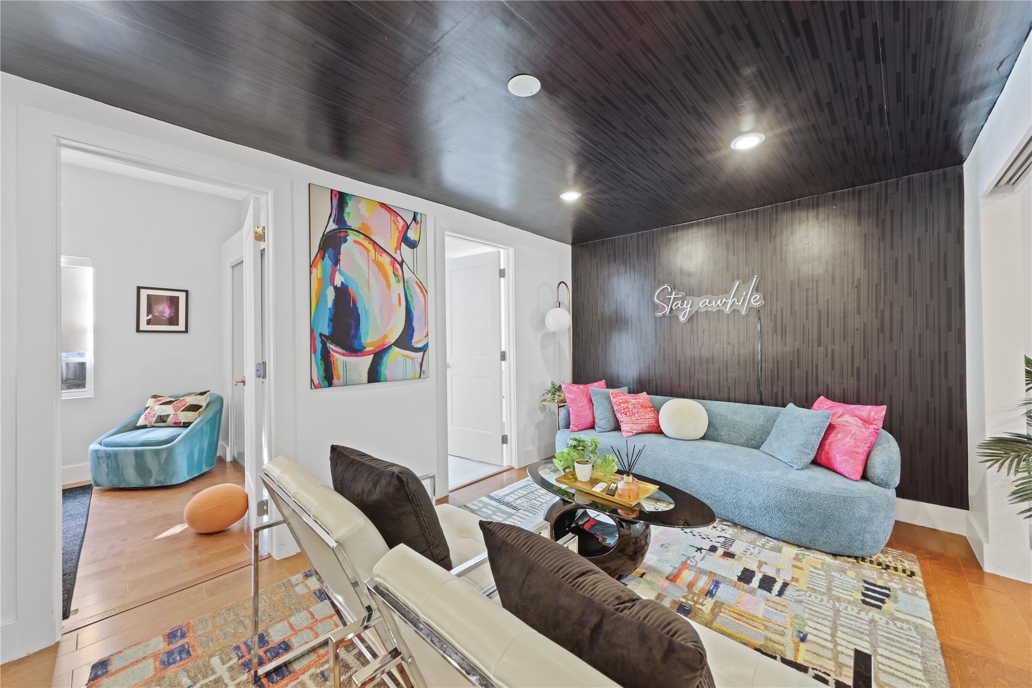 Den between 3 guest rooms