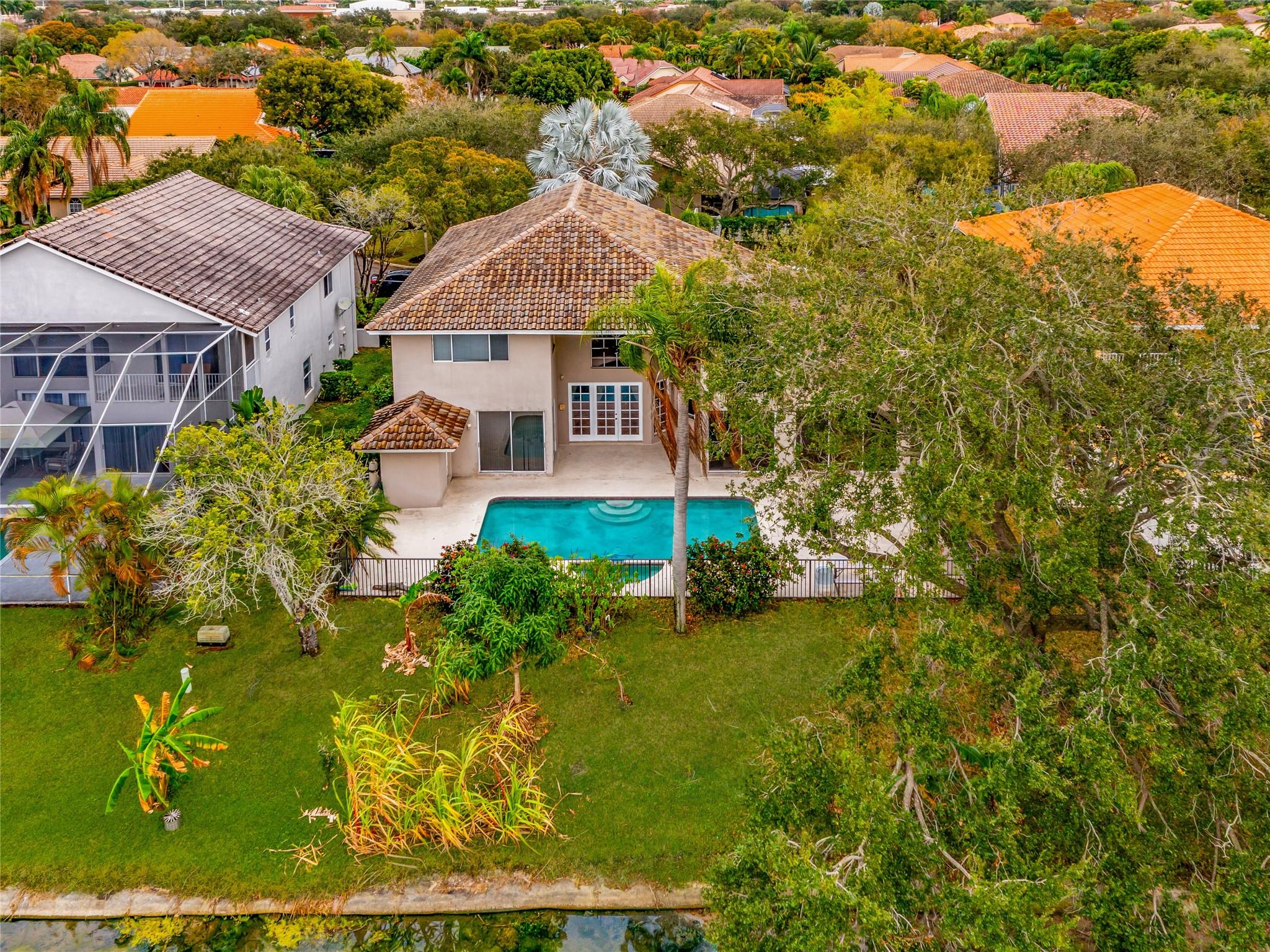 PATIO, POOL, SPA, LARGE YARD AND LAKE VIEW