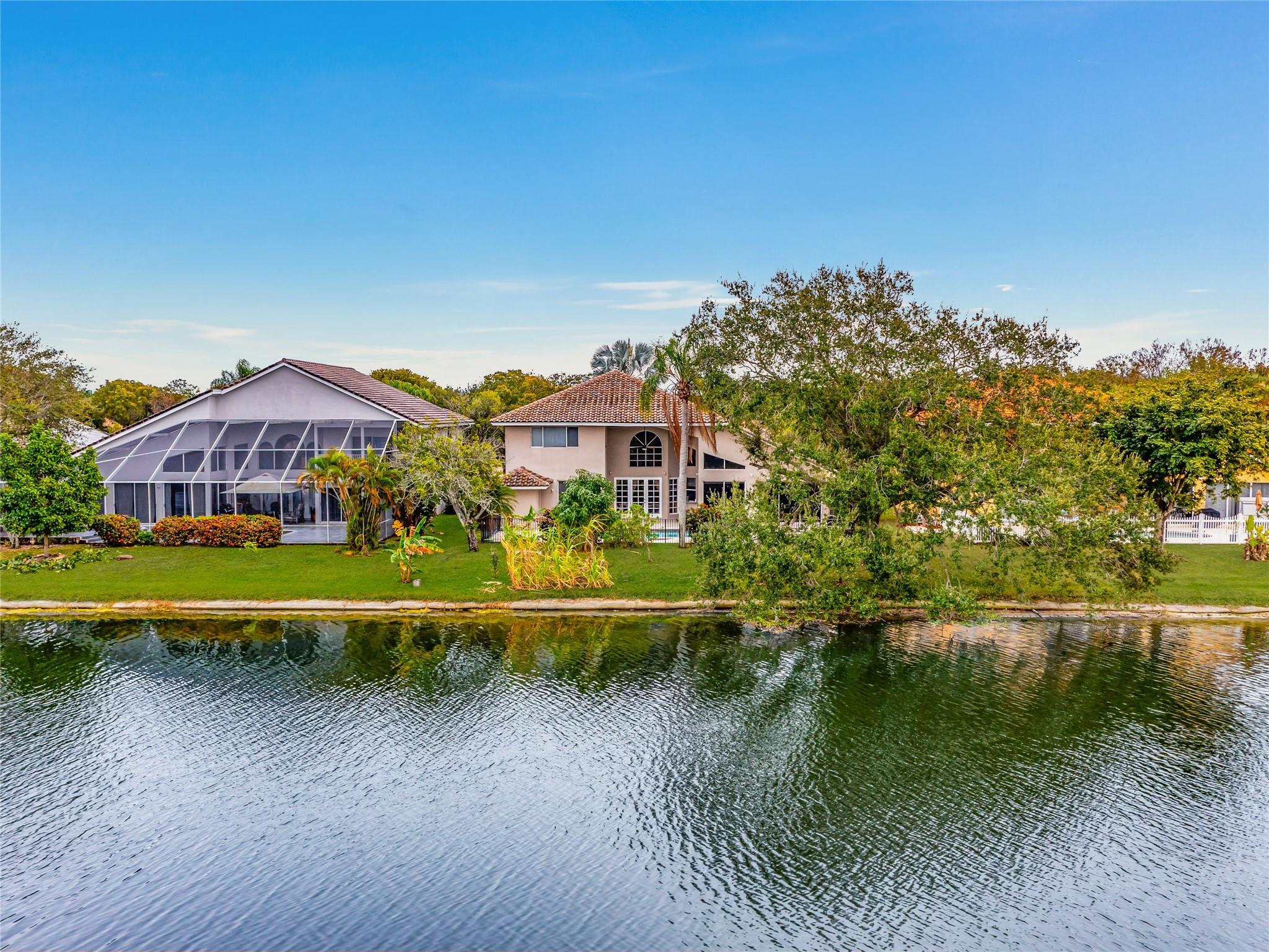 PATIO, POOL, SPA, LARGE YARD AND LAKE VIEW