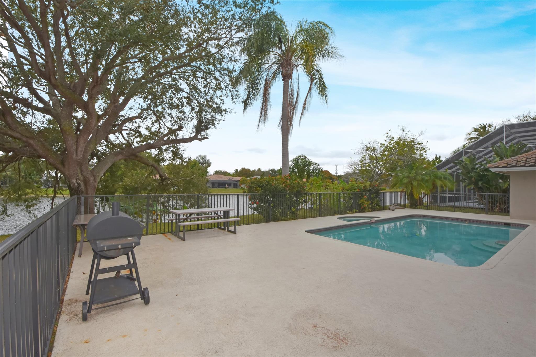 PATIO, POOL, SPA, LARGE YARD AND LAKE VIEW