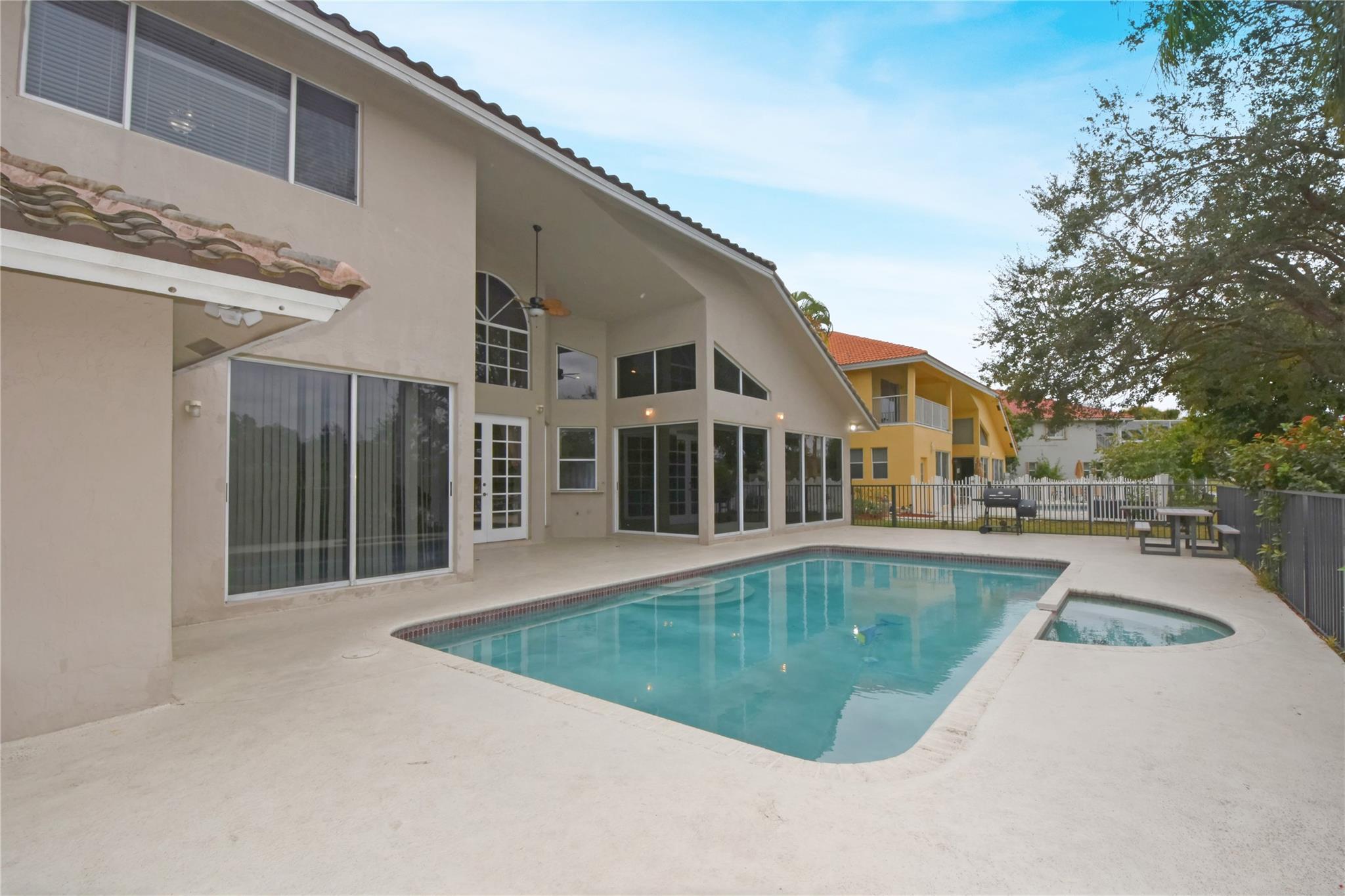 PATIO, POOL, SPA, LARGE YARD AND LAKE VIEW
