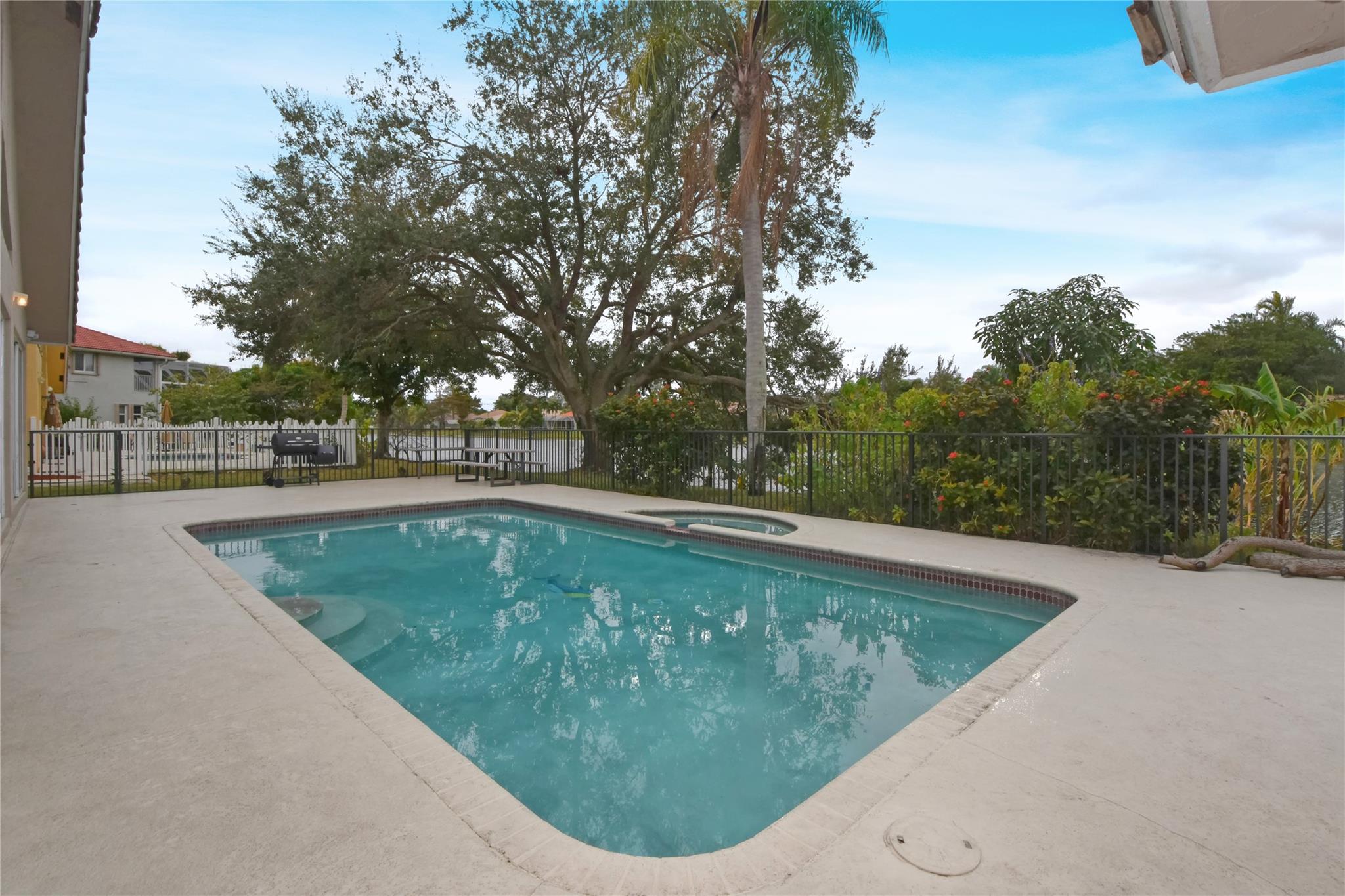 PATIO, POOL, SPA, LARGE YARD AND LAKE VIEW