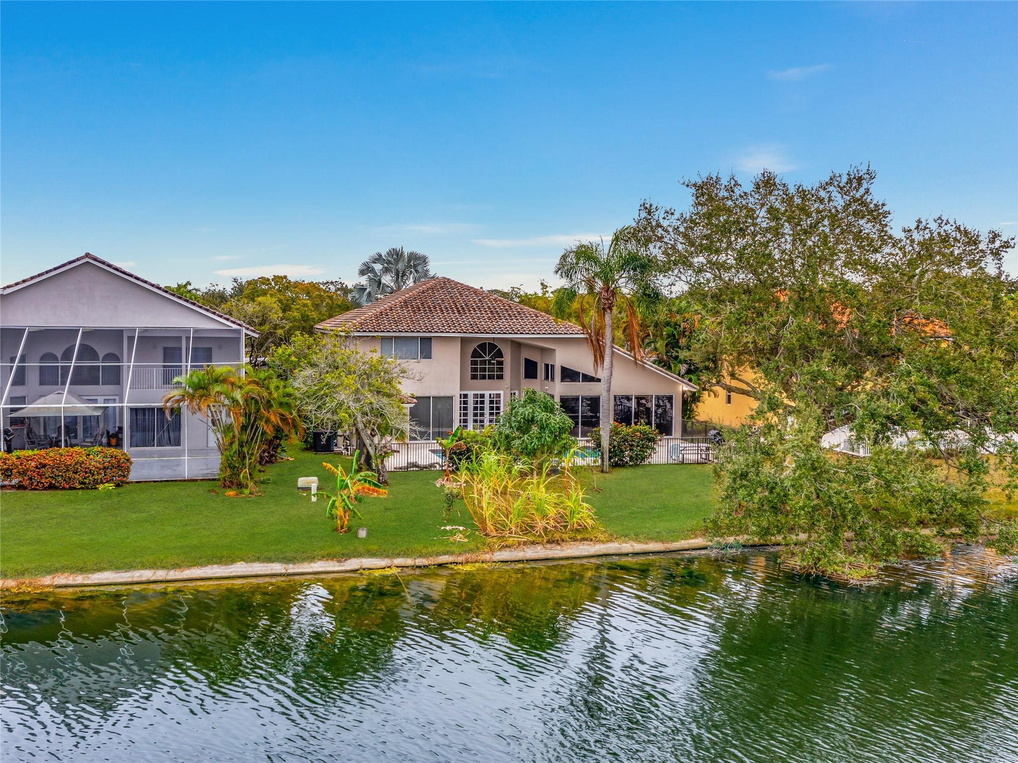 PATIO, POOL, SPA, LARGE YARD AND LAKE VIEW