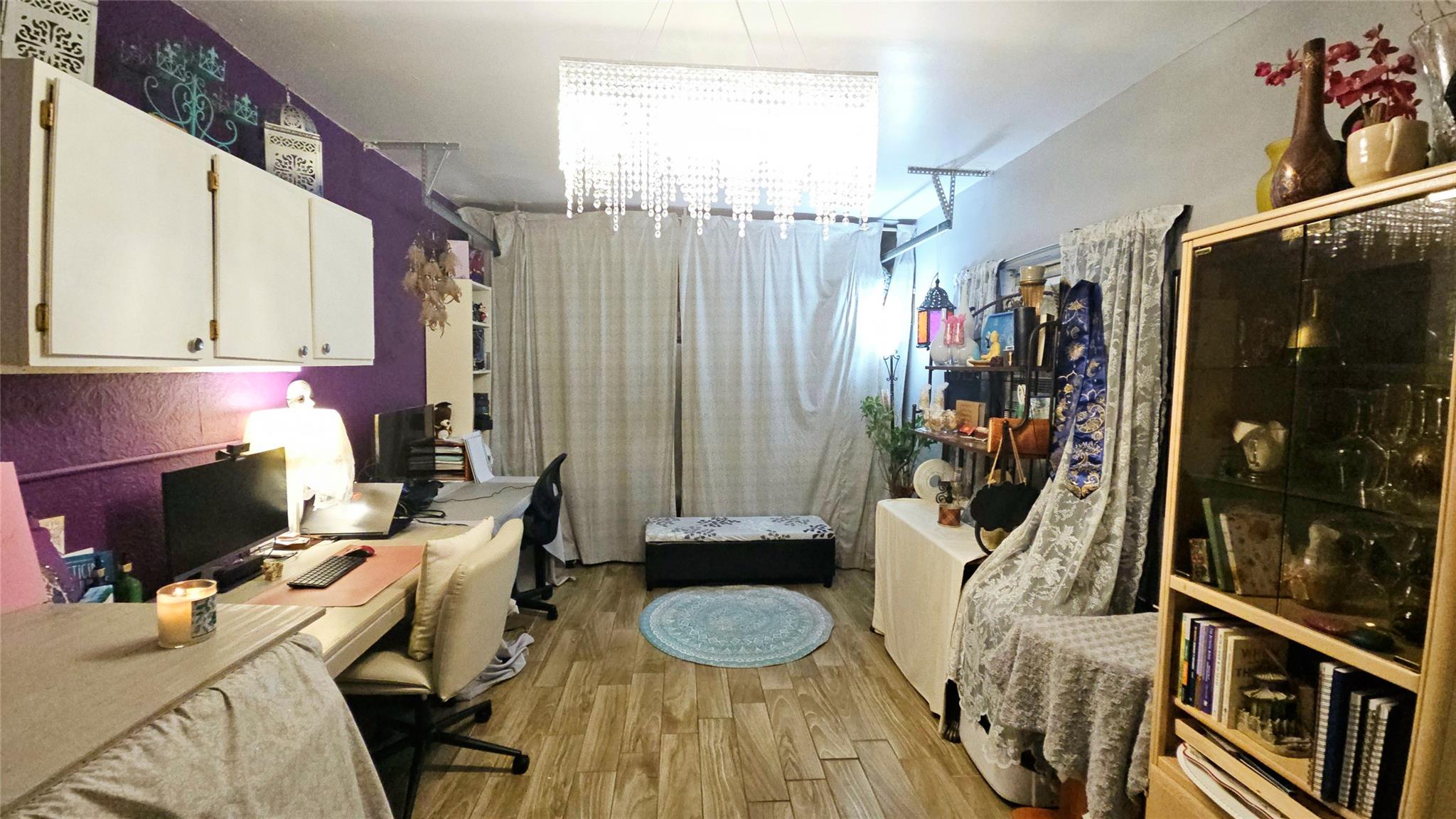 Insulated garage with garage door still functional located behind the curtain