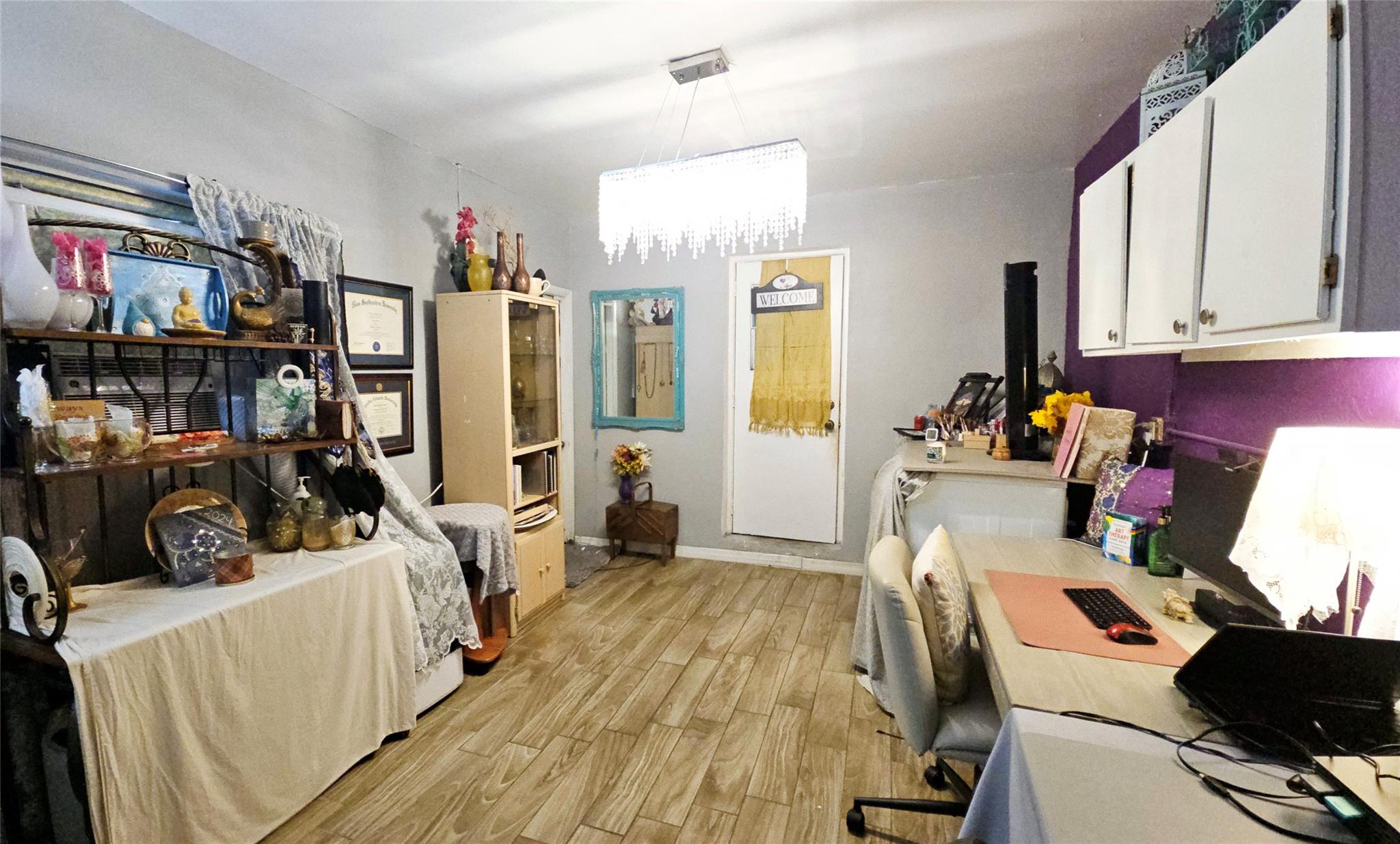 Window located behind shelving on left with AC