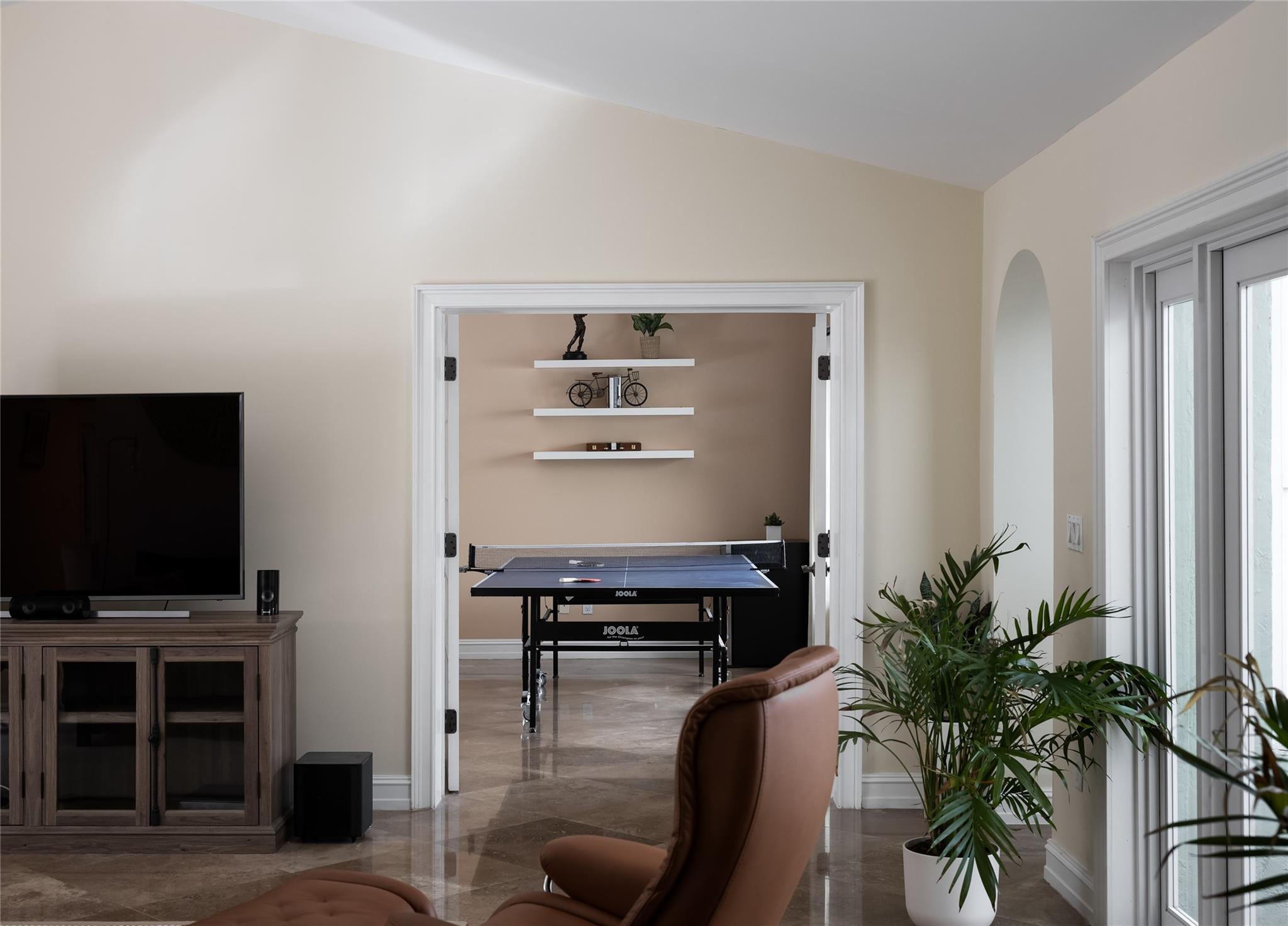 Off the family room is a separate large entertainment room