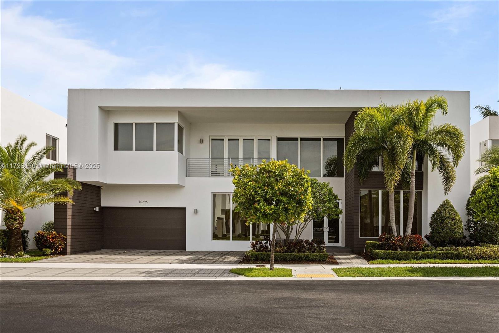 Welcome to Modern Doral 75, where luxury and comfort meet in one of Doral's most sought-after communities. This exquisite home features 5 spacious bedrooms, 5.5 bathrooms, a flexible den, and a 4-car garage. Designed for modern living, it includes an advanced alkaline water filtration system and a Smart Home Package.  The gourmet kitchen boasts quartz countertops, Viking appliances, and Italian cabinetry, making it a chef’s delight. Outside, enjoy a private retreat with a heated saltwater pool, pergola, and summer kitchen, perfect for entertaining.  Located in a gated community known for its high living standards and proximity to local schools, this home offers both sophistication and practicality. Don’t miss the opportunity to live in one of Doral’s most exclusive neighborhoods.