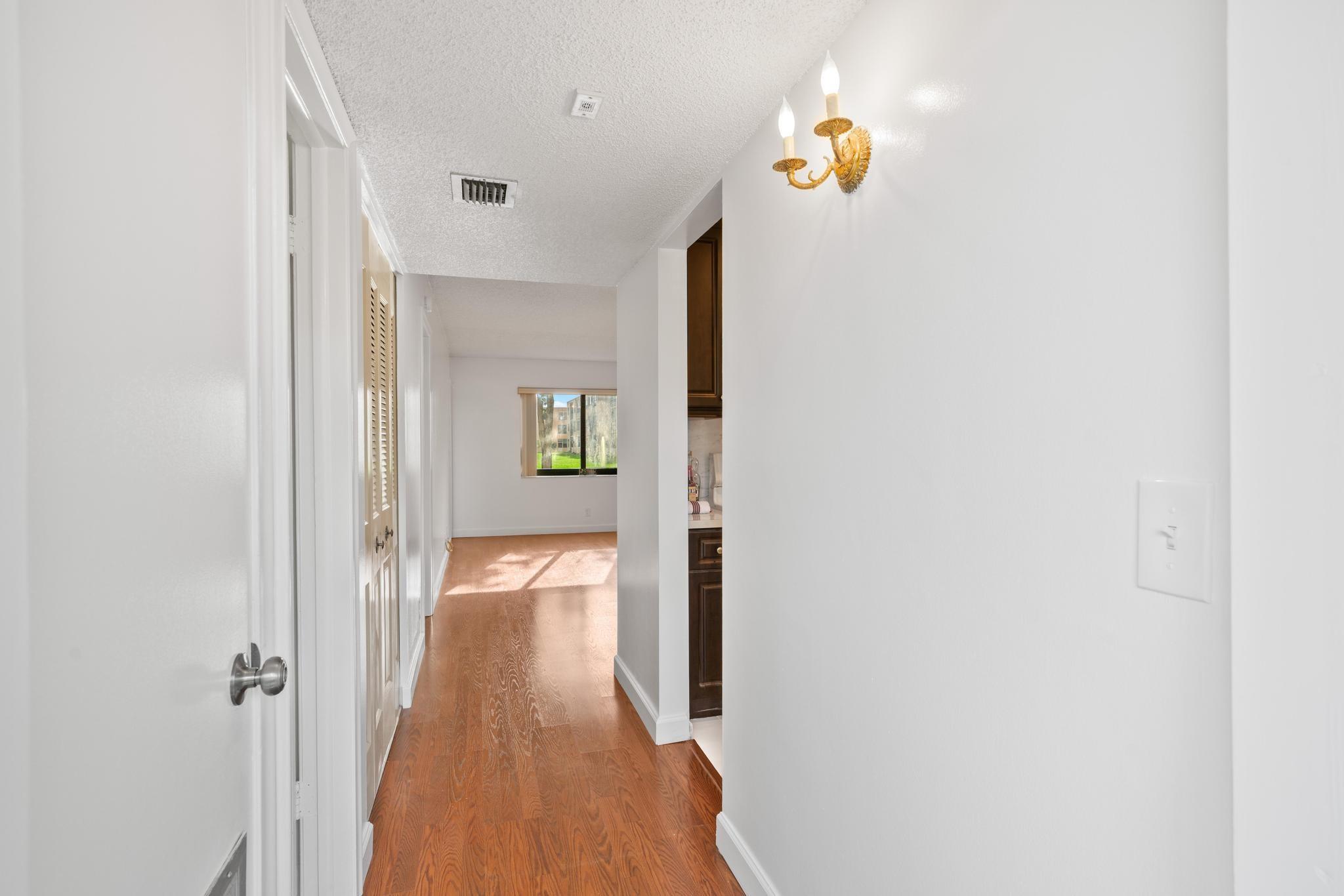 Wood flooring flows throughout the freshly painted interior.