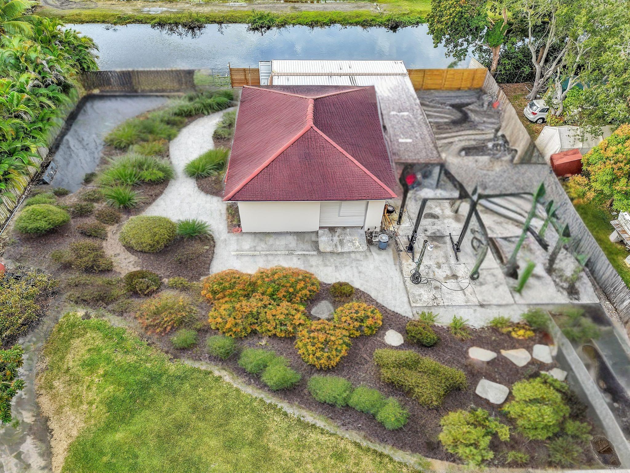 Rendering of back yard with equipment removed and some landscaping installed.