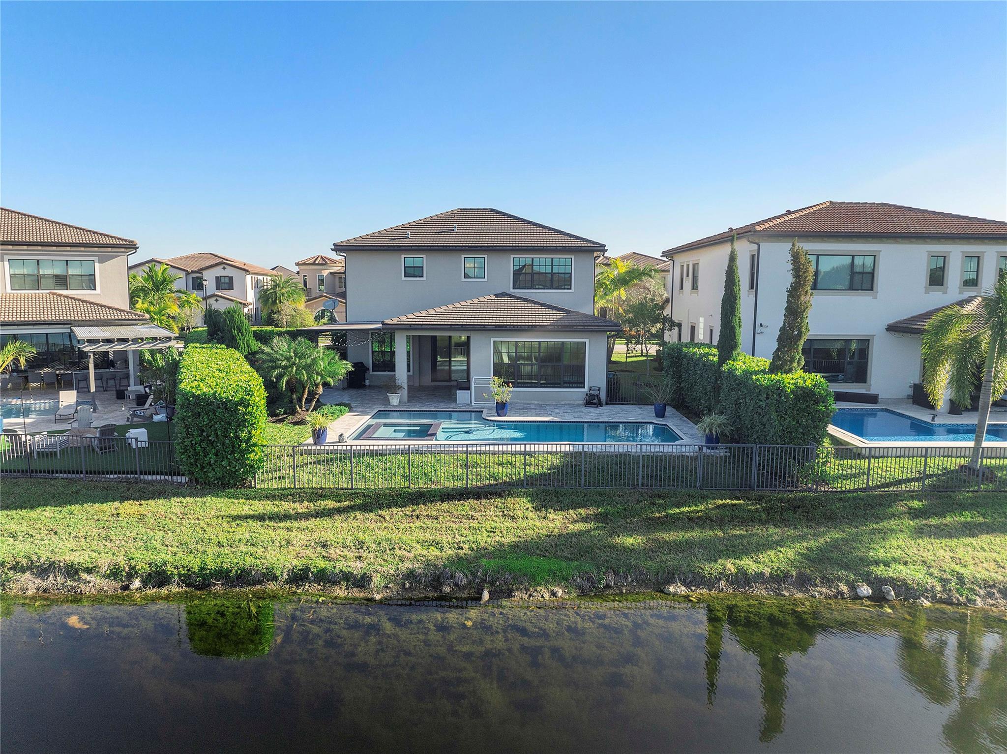 Pretty lake with a deserted island behind which gives great privacy when entertaining in the back garden and pool area,