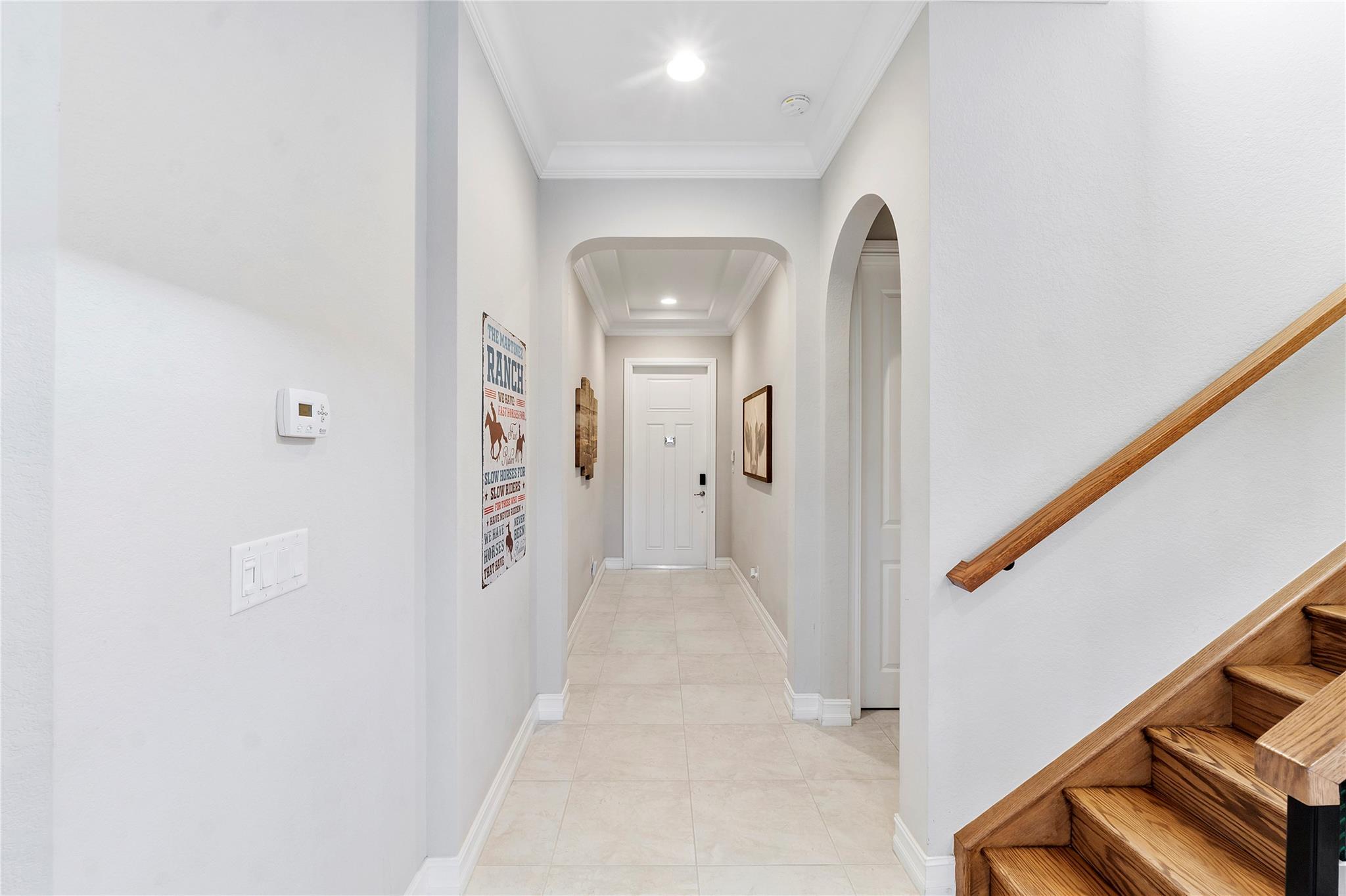 The entryway could be your gallery with all your favorite frames, As you walk into this home all the way into the family room,